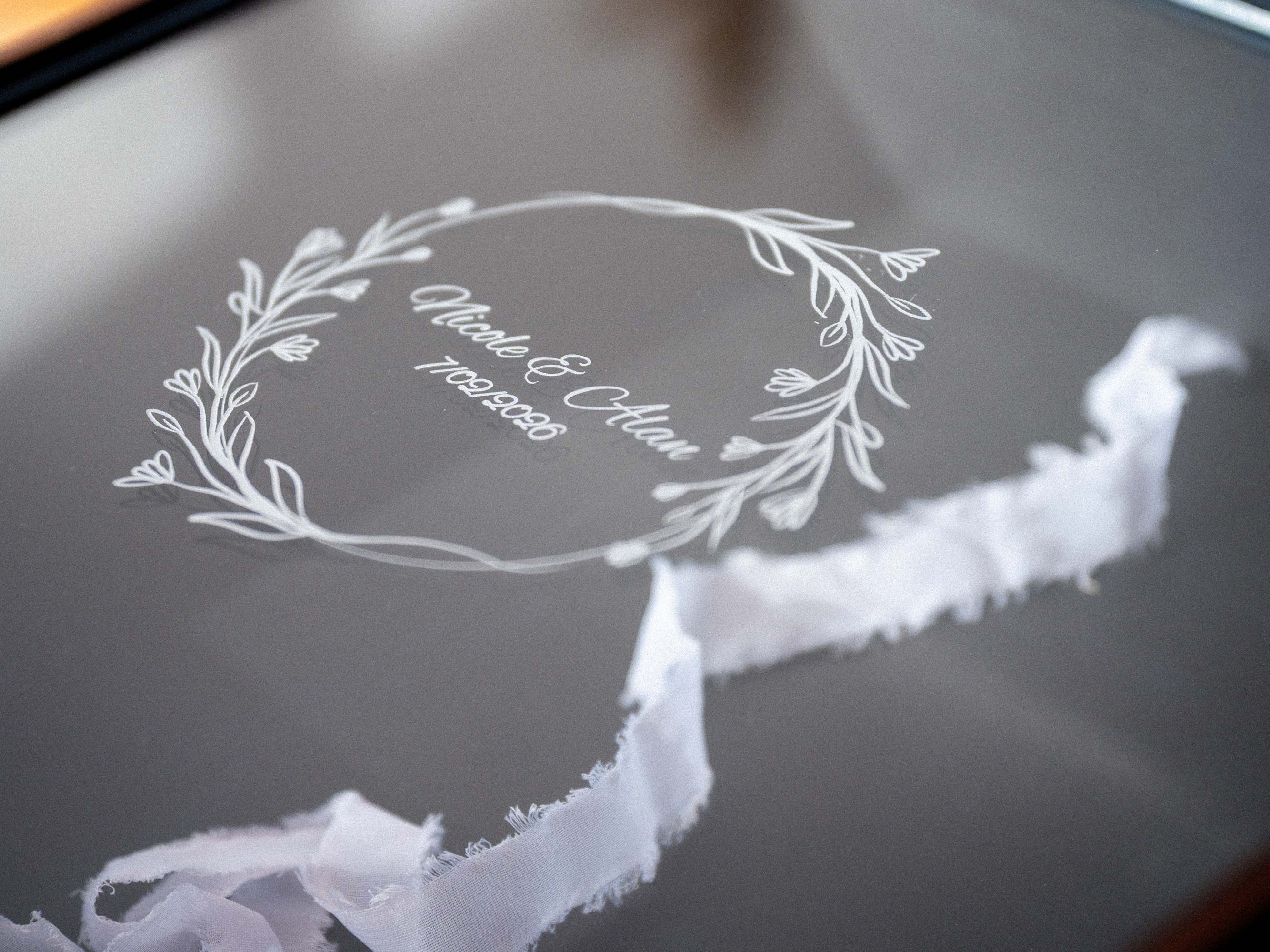 Engraved acrylic lid detail on black wooden photo album box