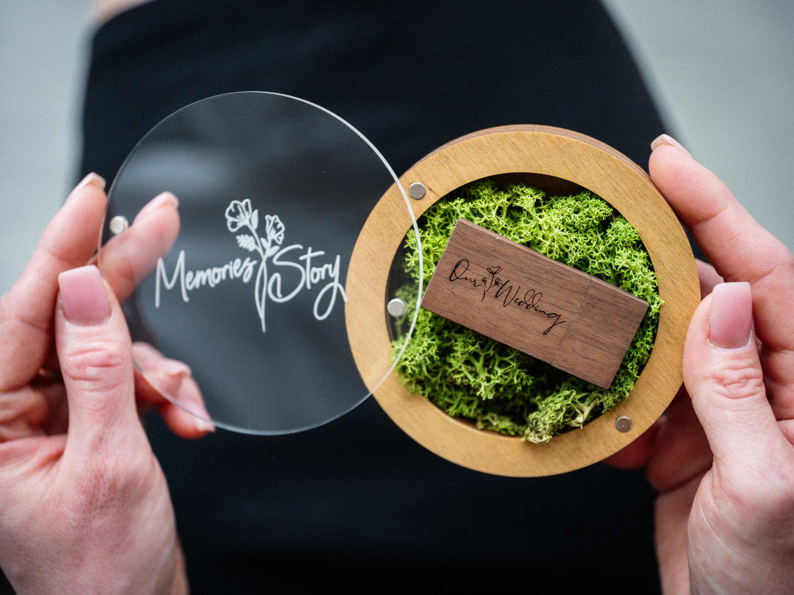 Open Gold Oak wedding USB box with acrylic lid and wooden flash drive in hands