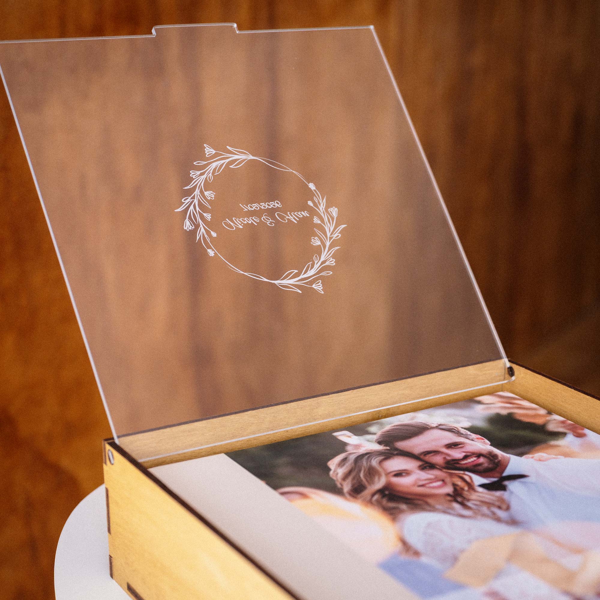 Close-up of personalized acrylic lid on Gold Oak wooden album box for wedding memories