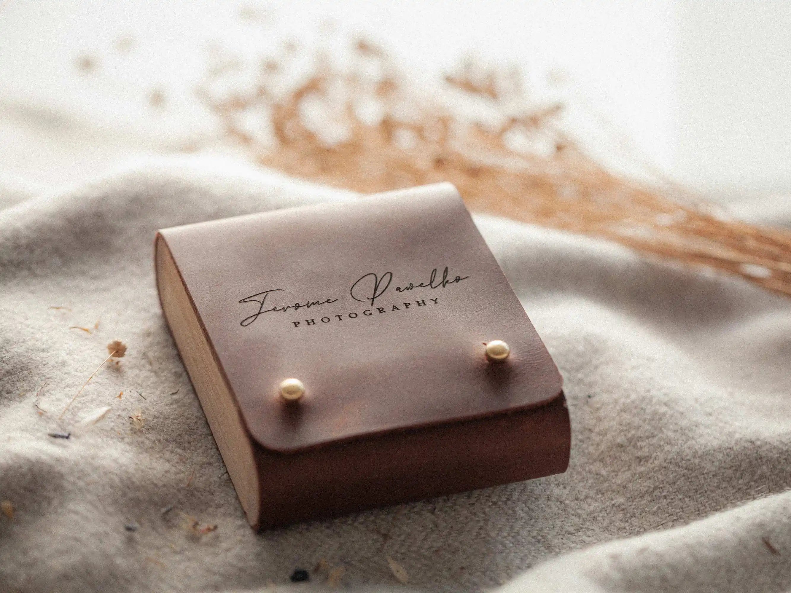 Cognac leather USB box on blanket with natural styling, premium USB packaging