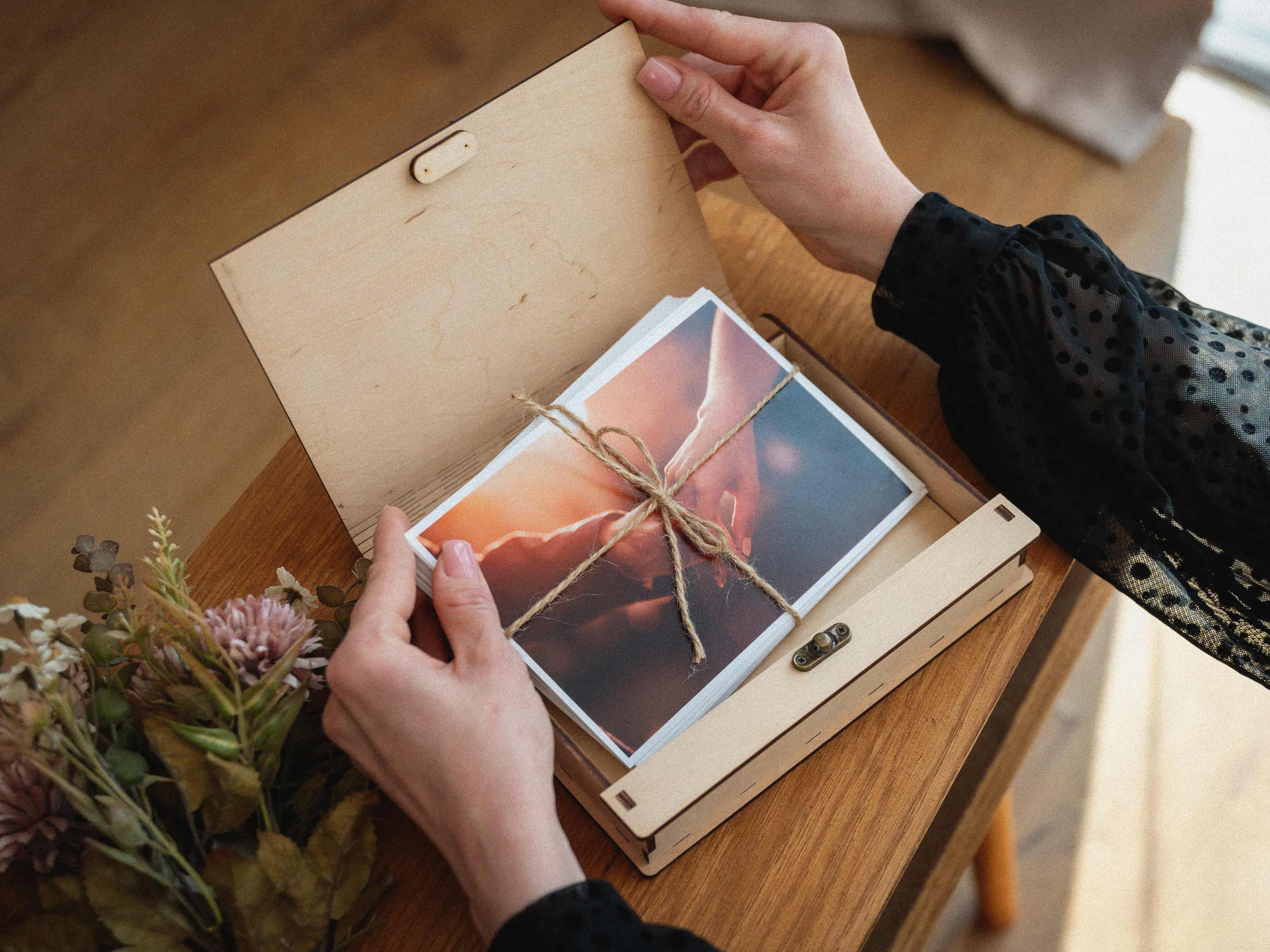 Open Maple photo box shown with wedding prints inside
