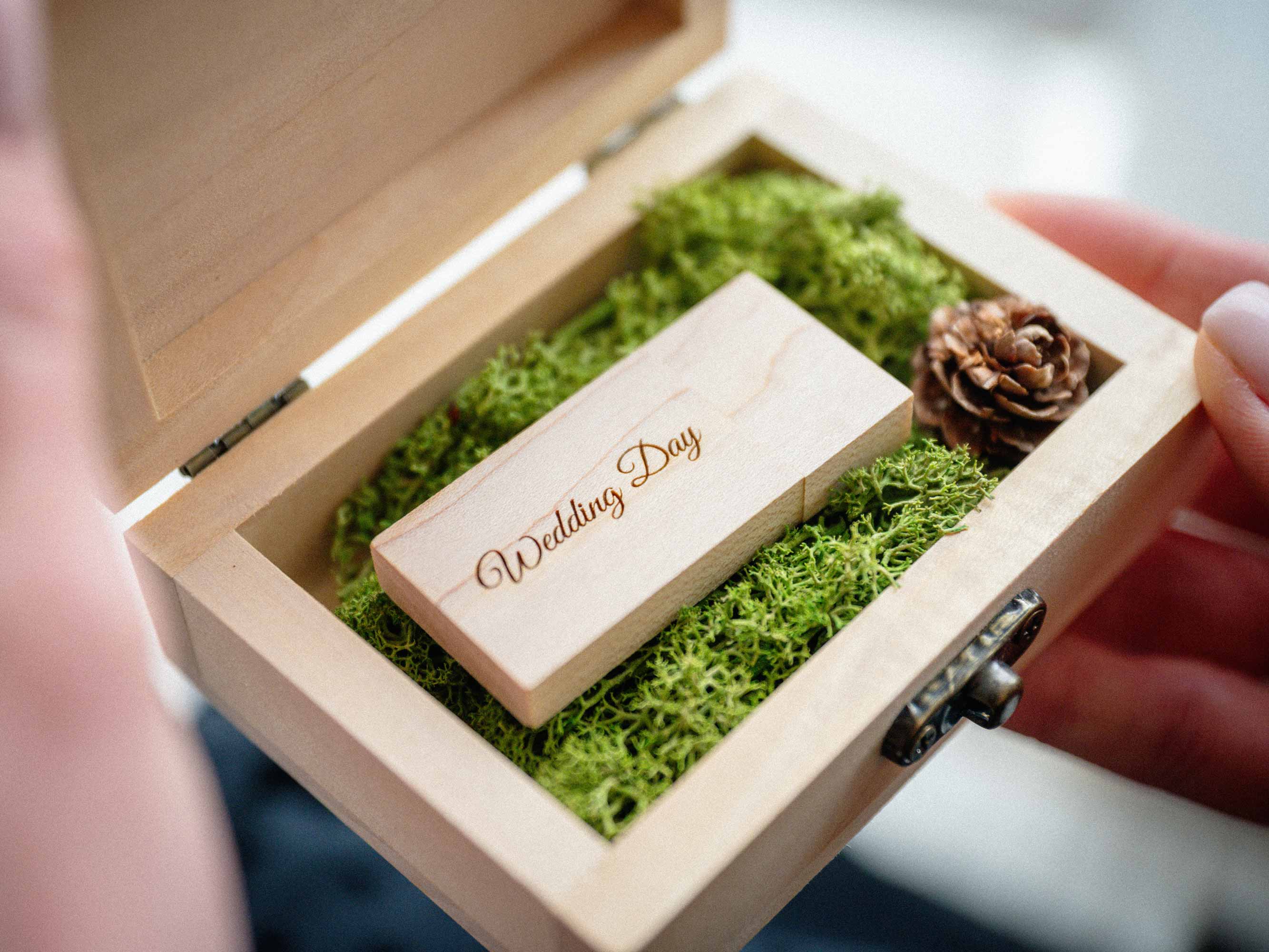 Natural USB box with wooden flash drive shown in hands