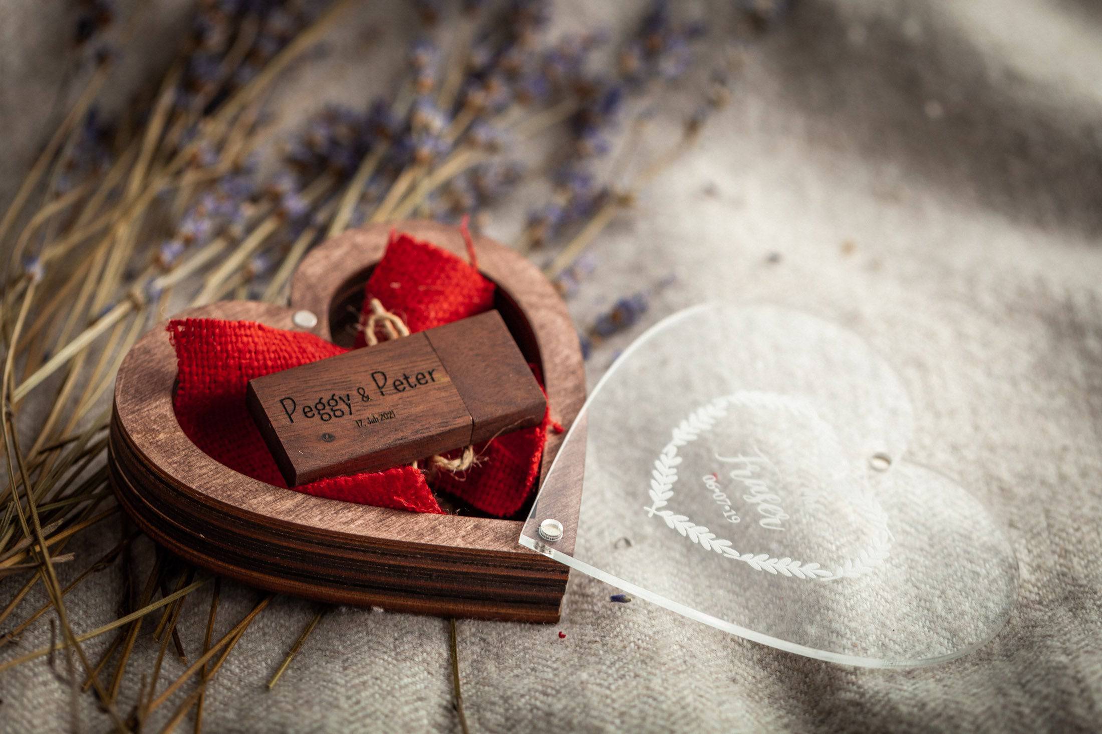 Close-up of engraved wooden USB in heart box