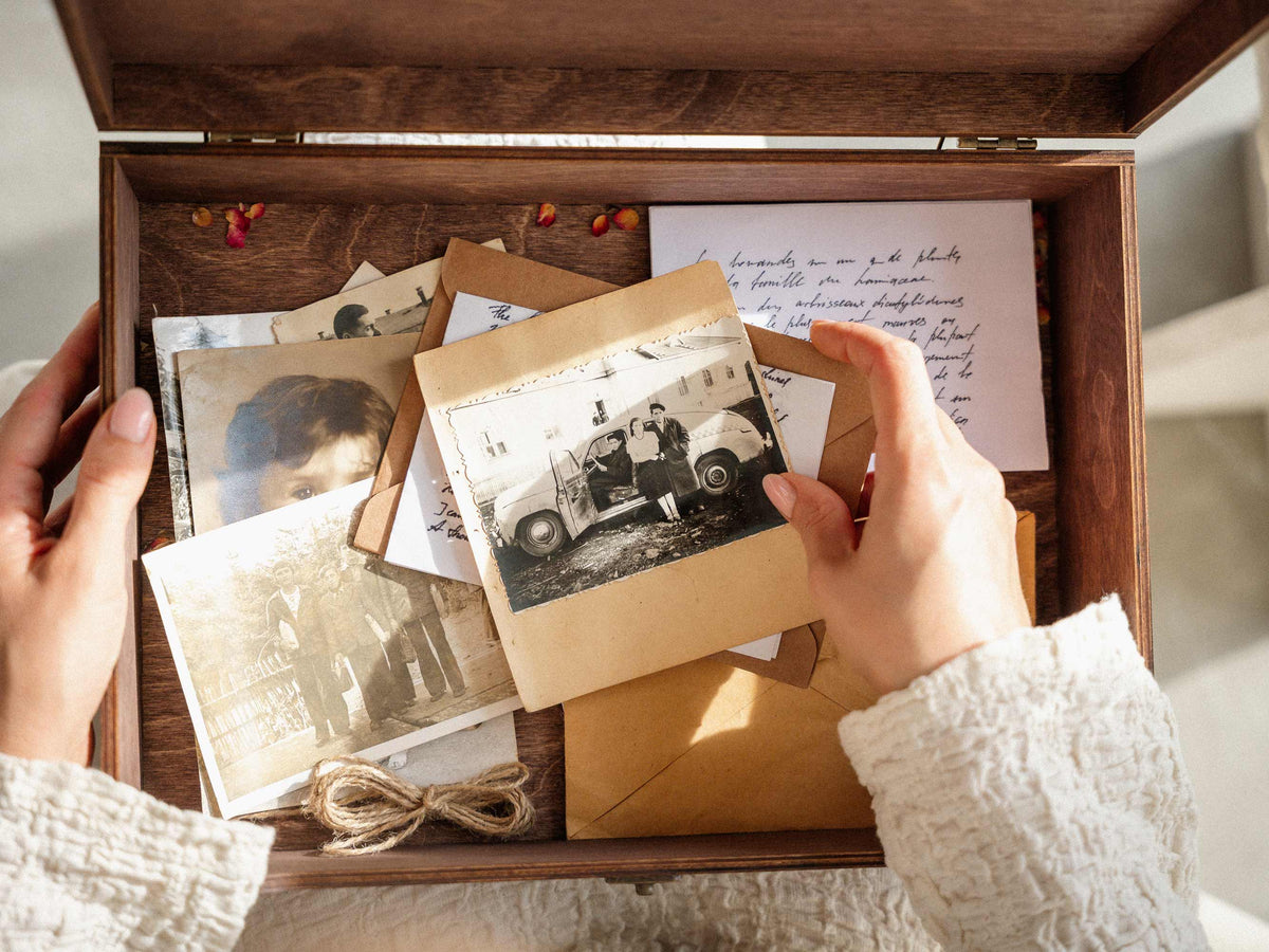 Large wooden wedding memory box filled with photos and keepsakes