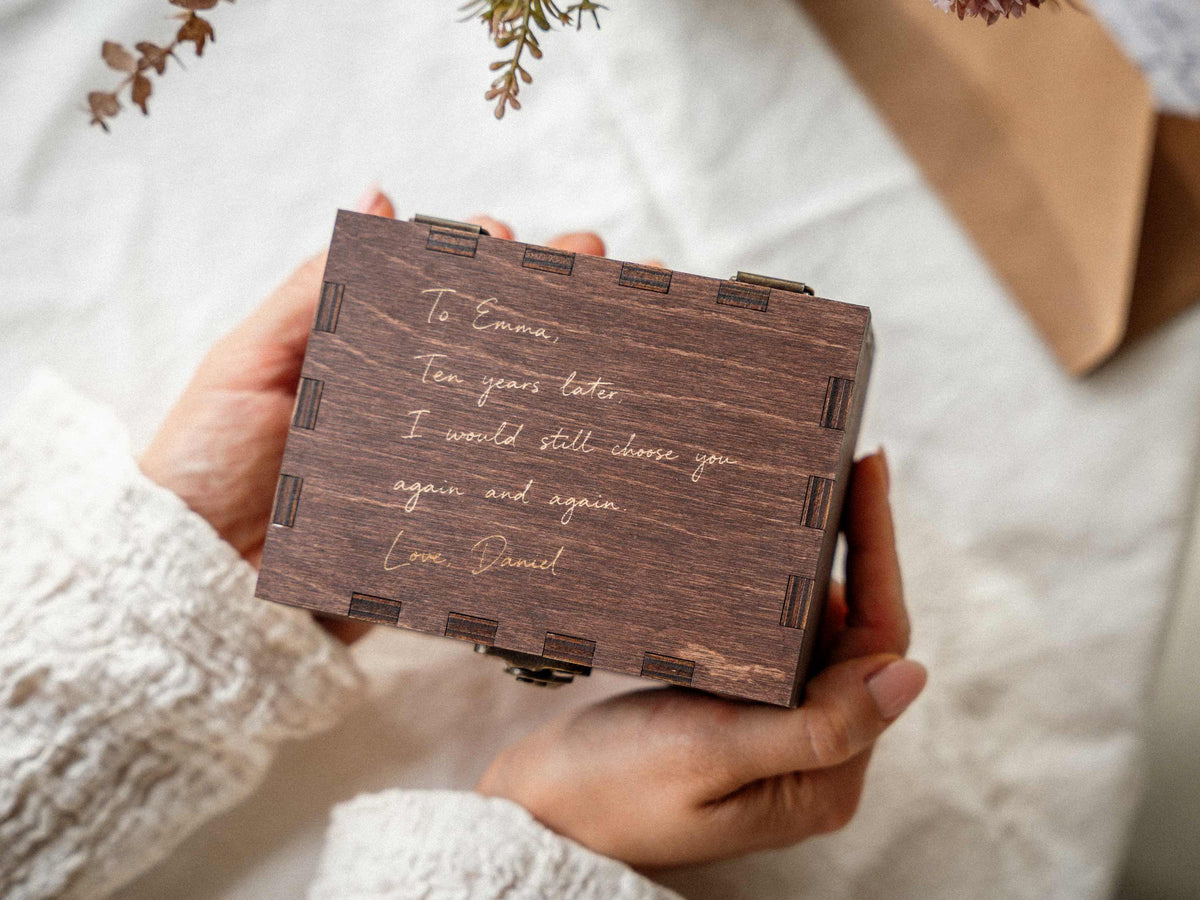 Small personalized wedding memory box held in hands