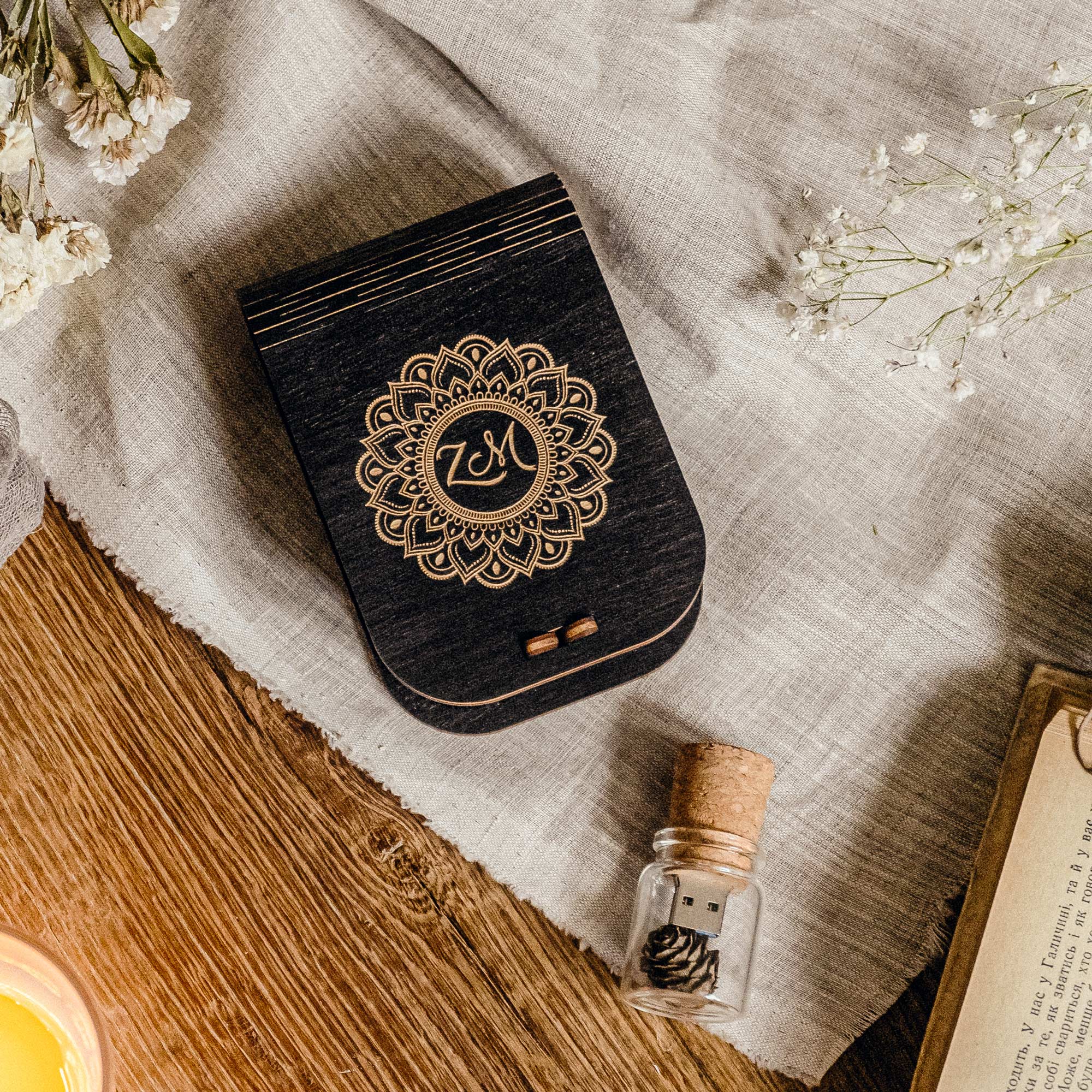 Black wedding USB box styled on linen with separate Glass Jar USB and dried flowers