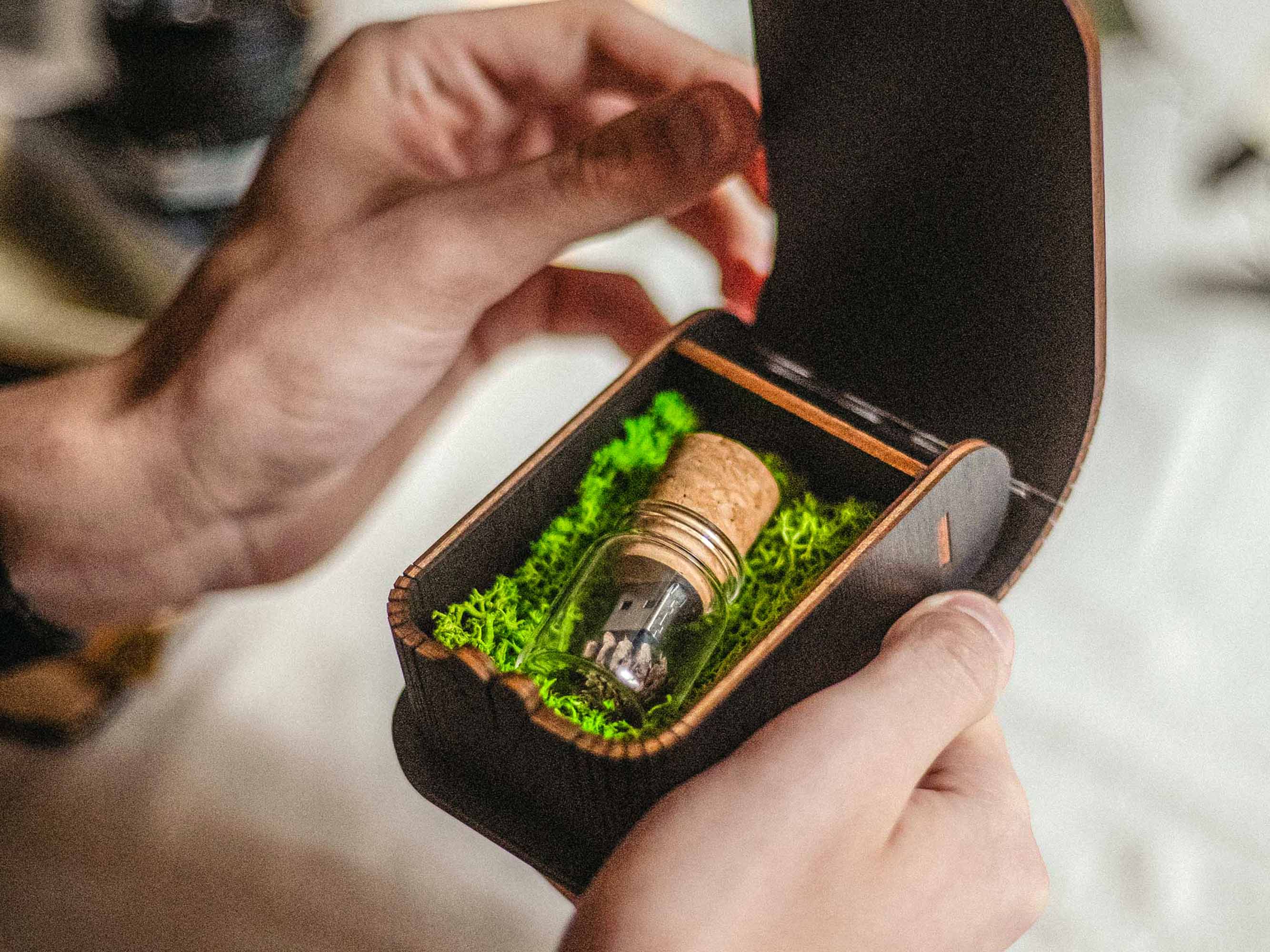 Black wooden wedding USB box open with Glass Jar USB 3.0 in green moss