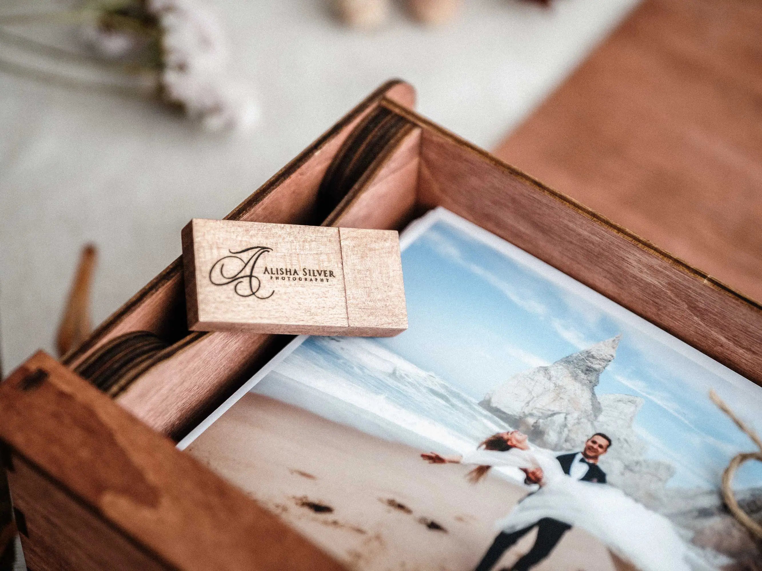 Open teak memory box with personalized wooden USB and printed photograph