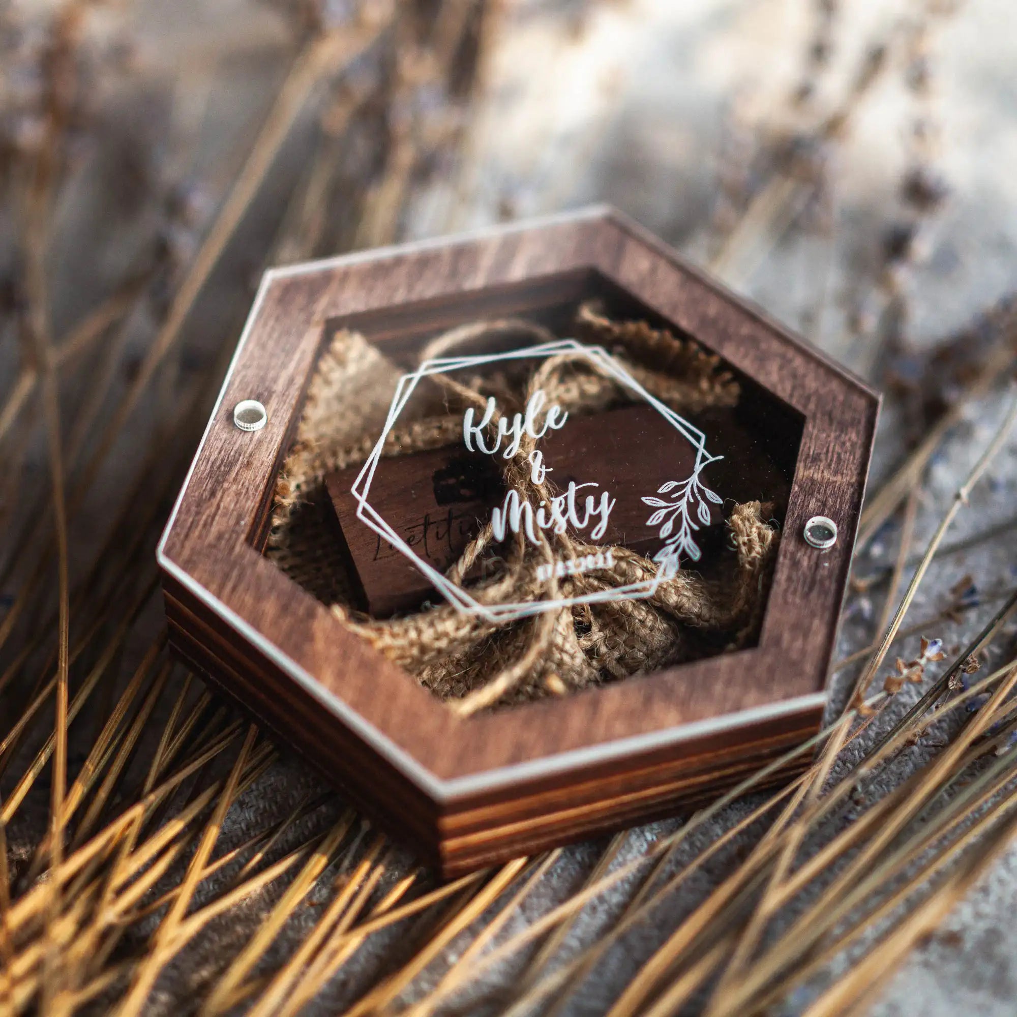 Walnut wooden wedding USB box with personalized acrylic lid on rustic background