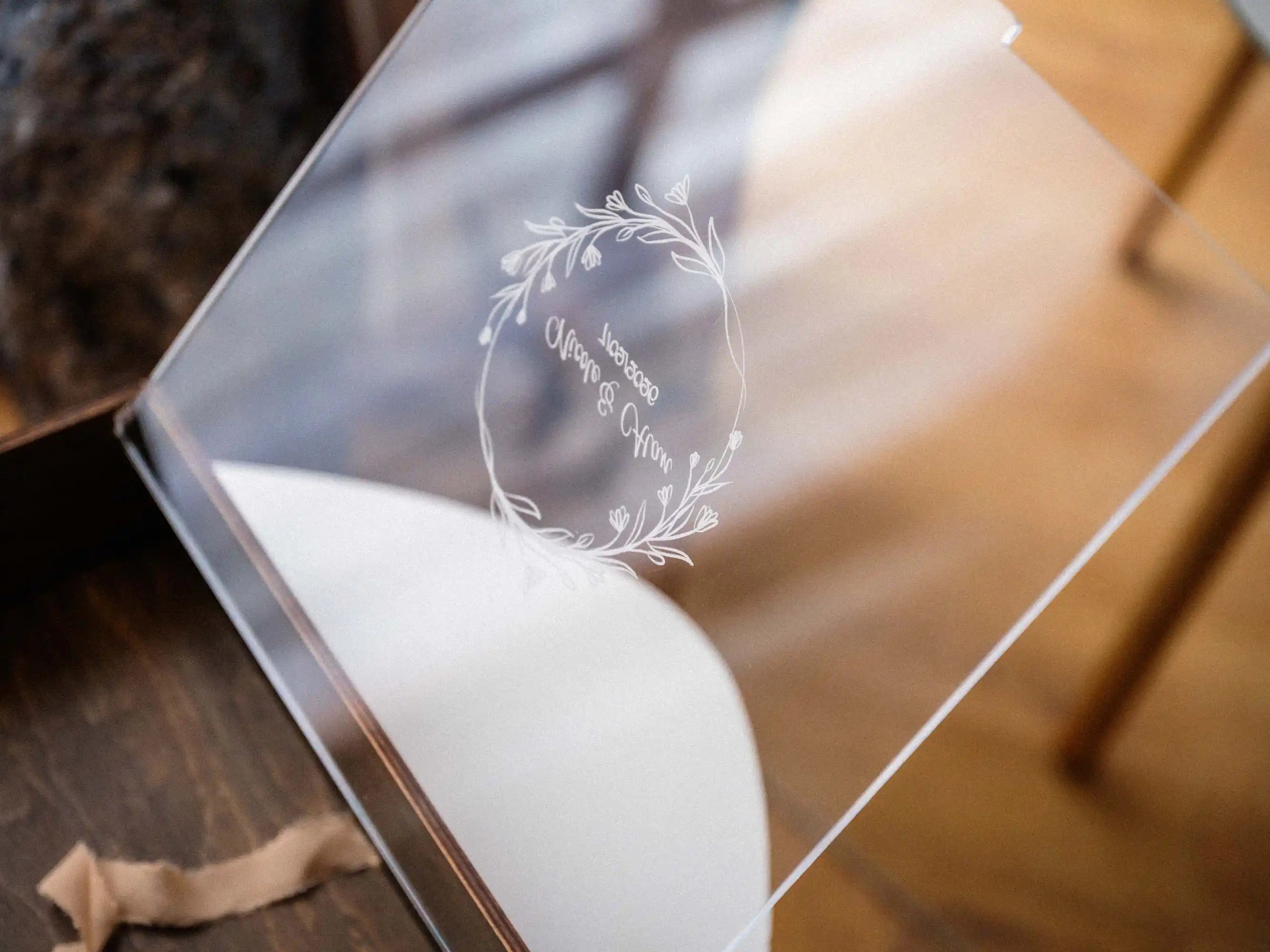 Transparent acrylic lid detail on a personalized walnut gift box