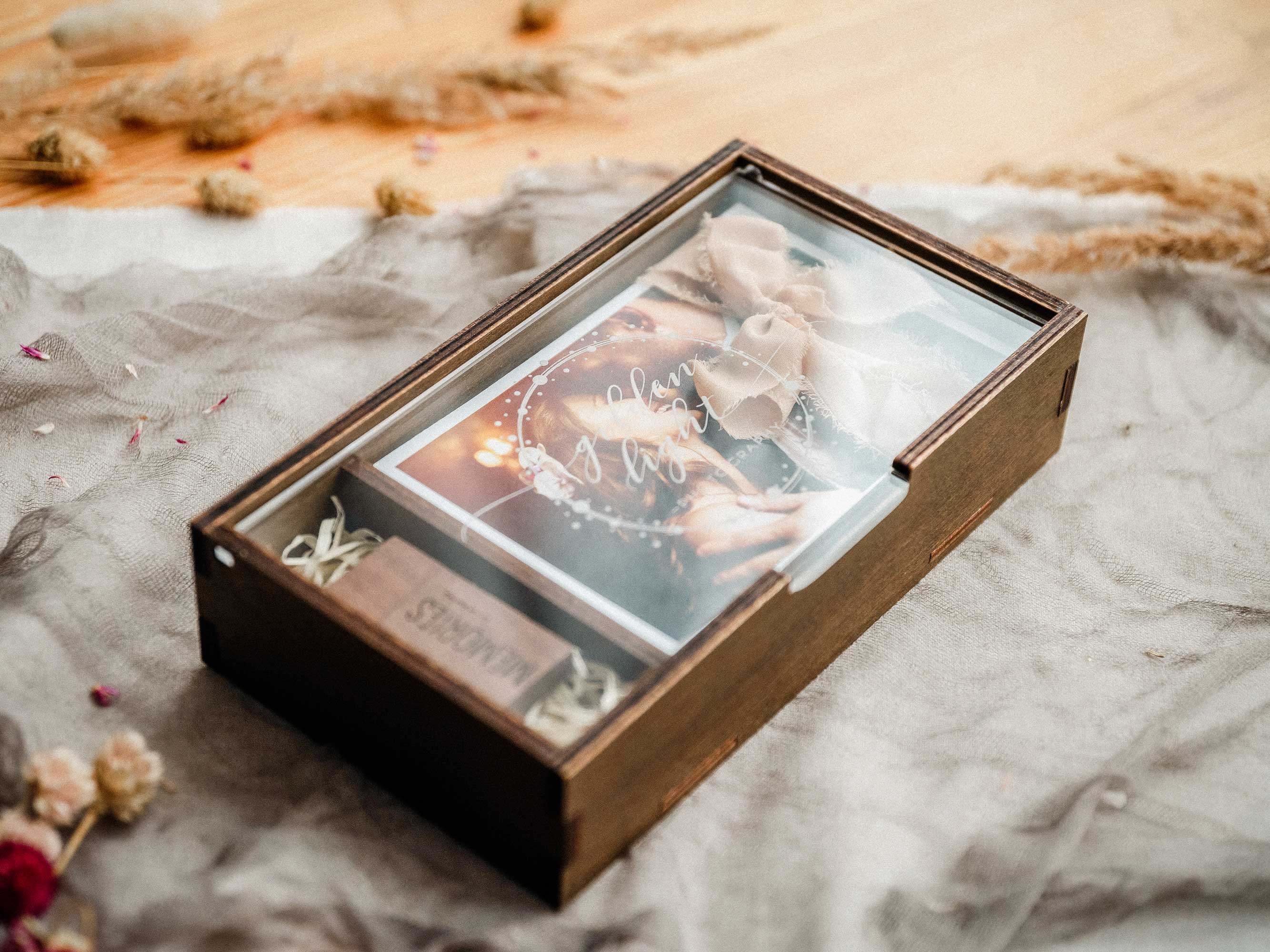 Wooden photo box with acrylic lid, USB compartment, and printed photo styled on soft fabric