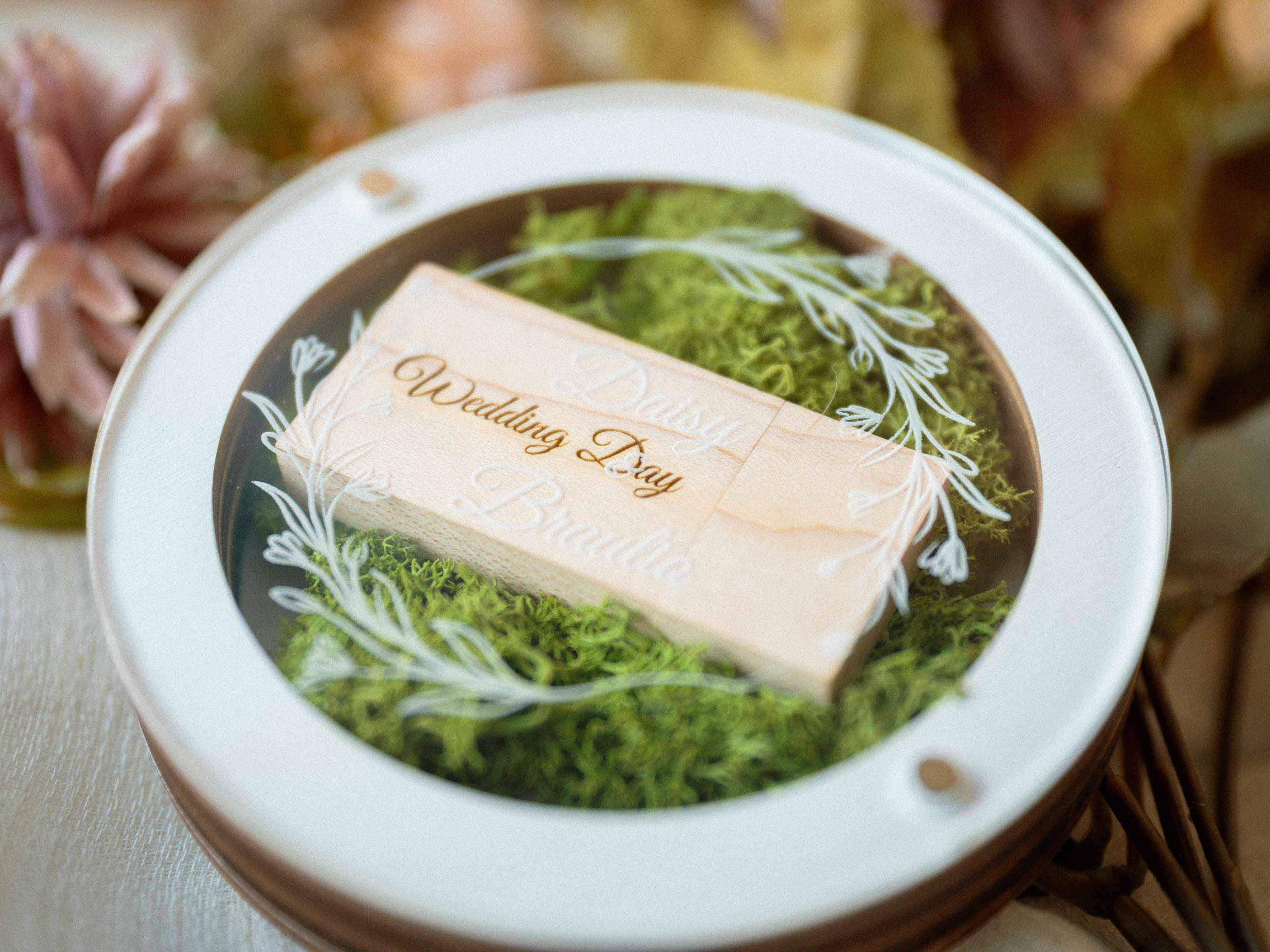 White wedding USB box with light wooden flash drive and stabilized green Scandinavian moss