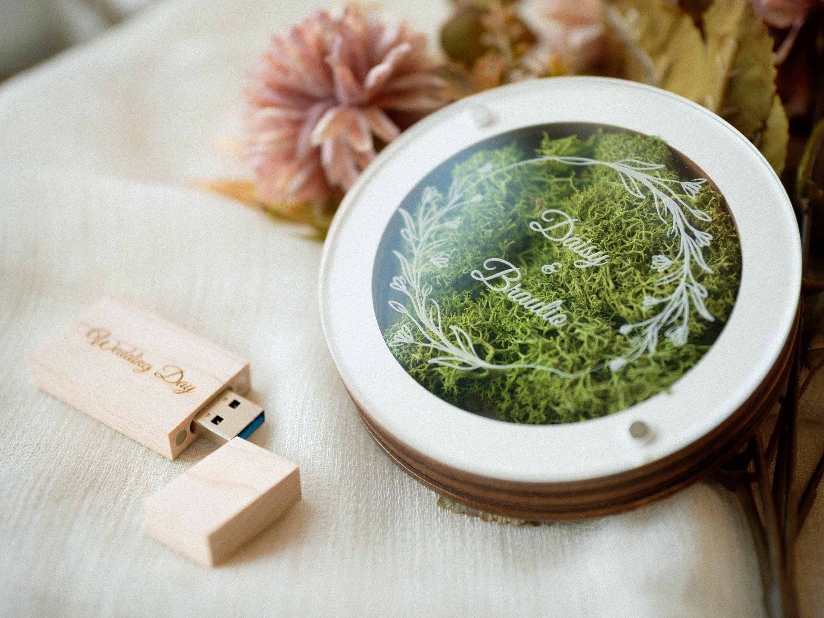 White USB box with light wooden flash drive placed beside the box