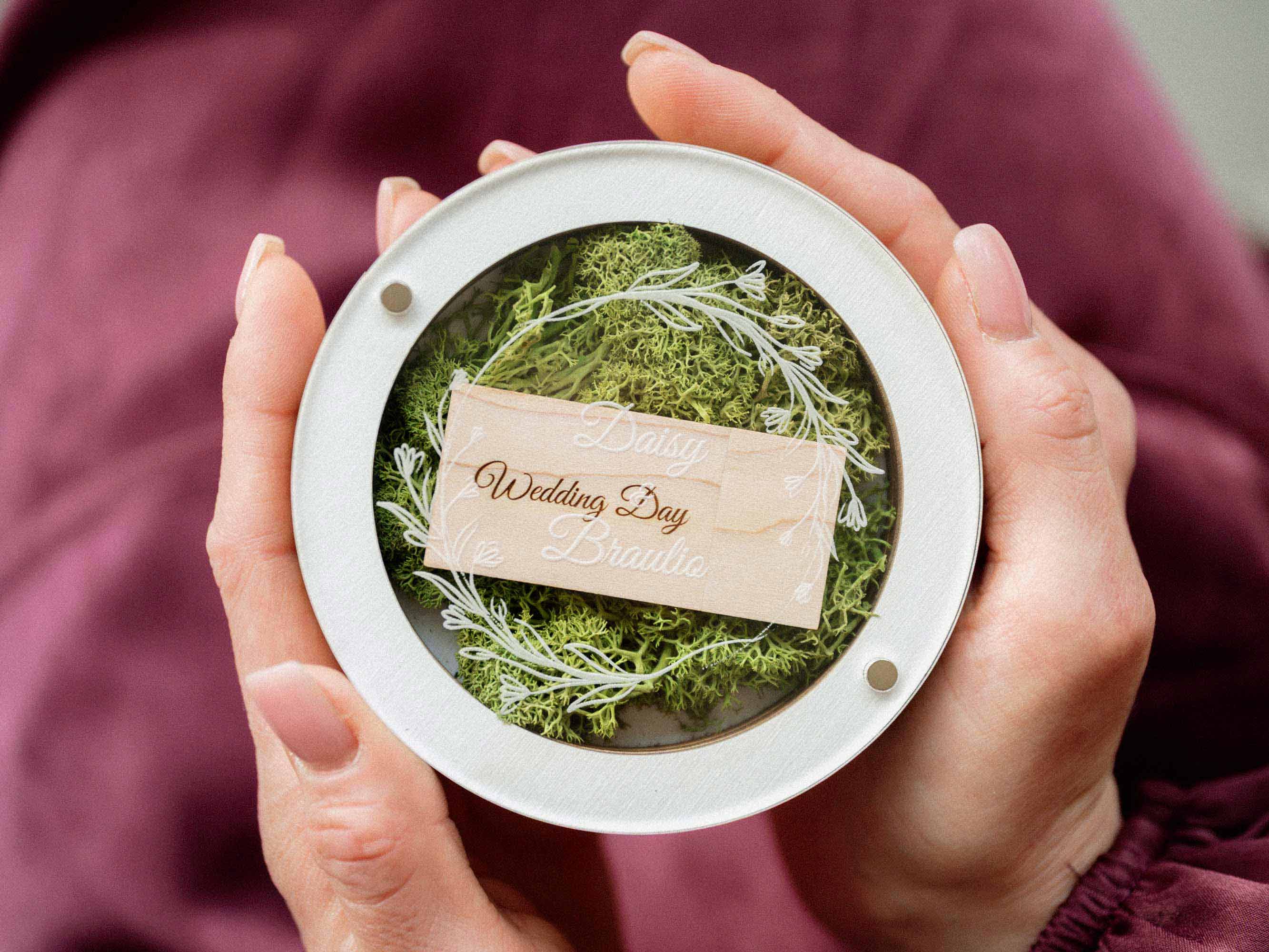 White wedding USB box shown in hands with light wooden flash drive inside