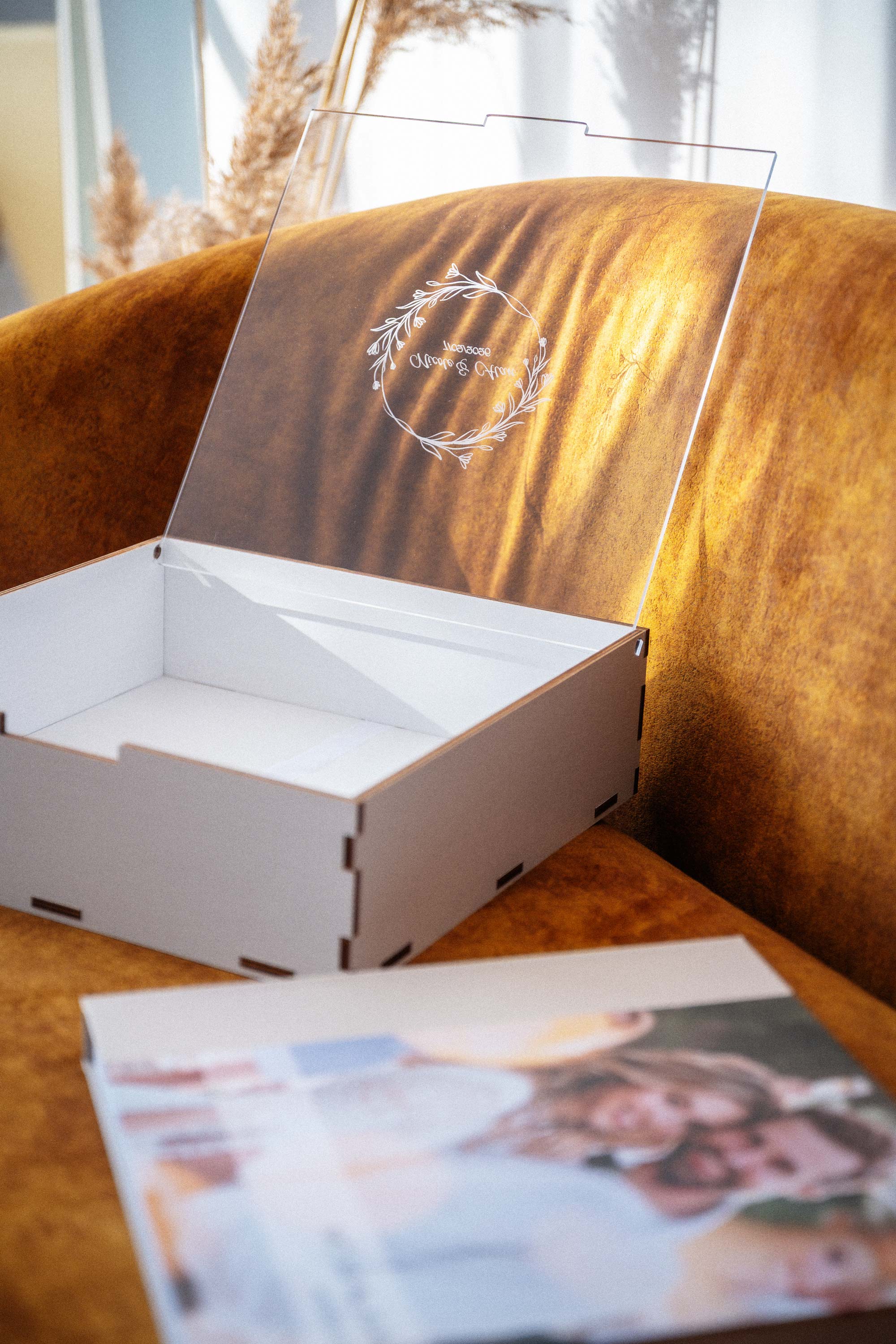 Empty white wooden keepsake box with acrylic lid for 10x10 photo album presentation