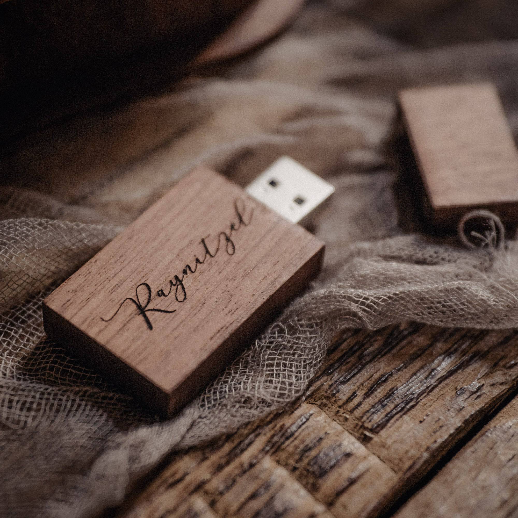 Personalized wooden USB flash drive for wedding photographers on rustic fabric