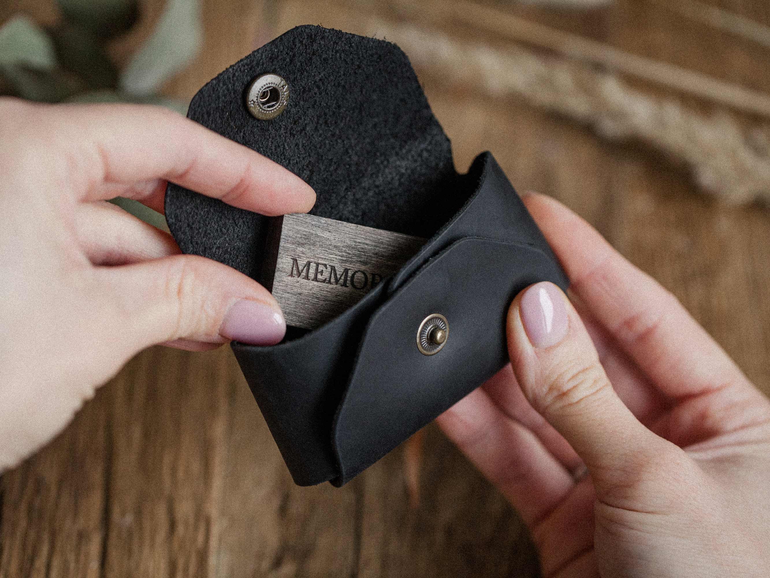 handmade black leather usb envelope in hands compact design