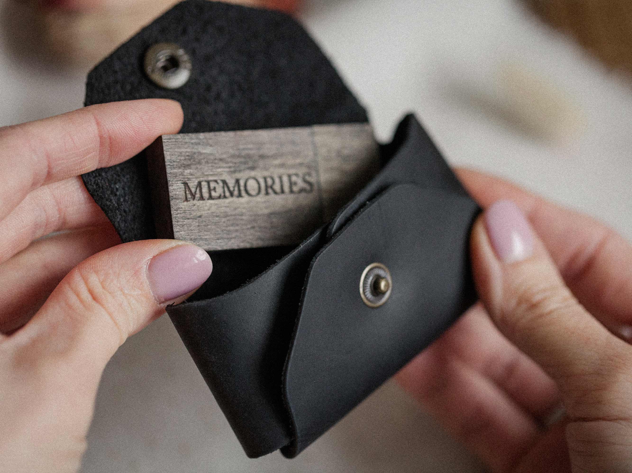 open black leather usb envelope with wooden flash drive inside