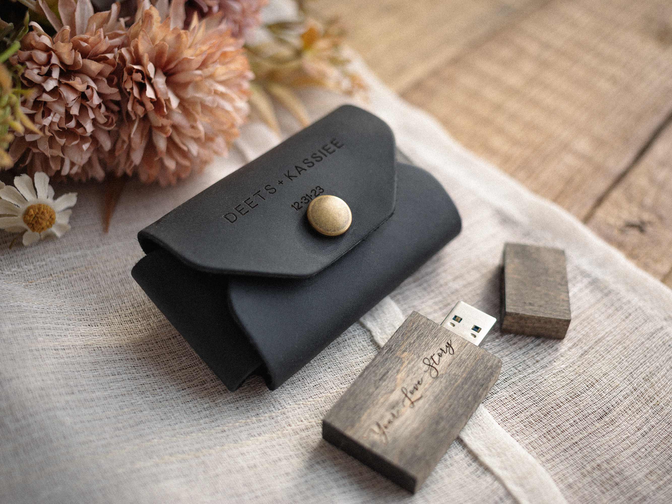 personalized black leather usb envelope with wooden usb on fabric