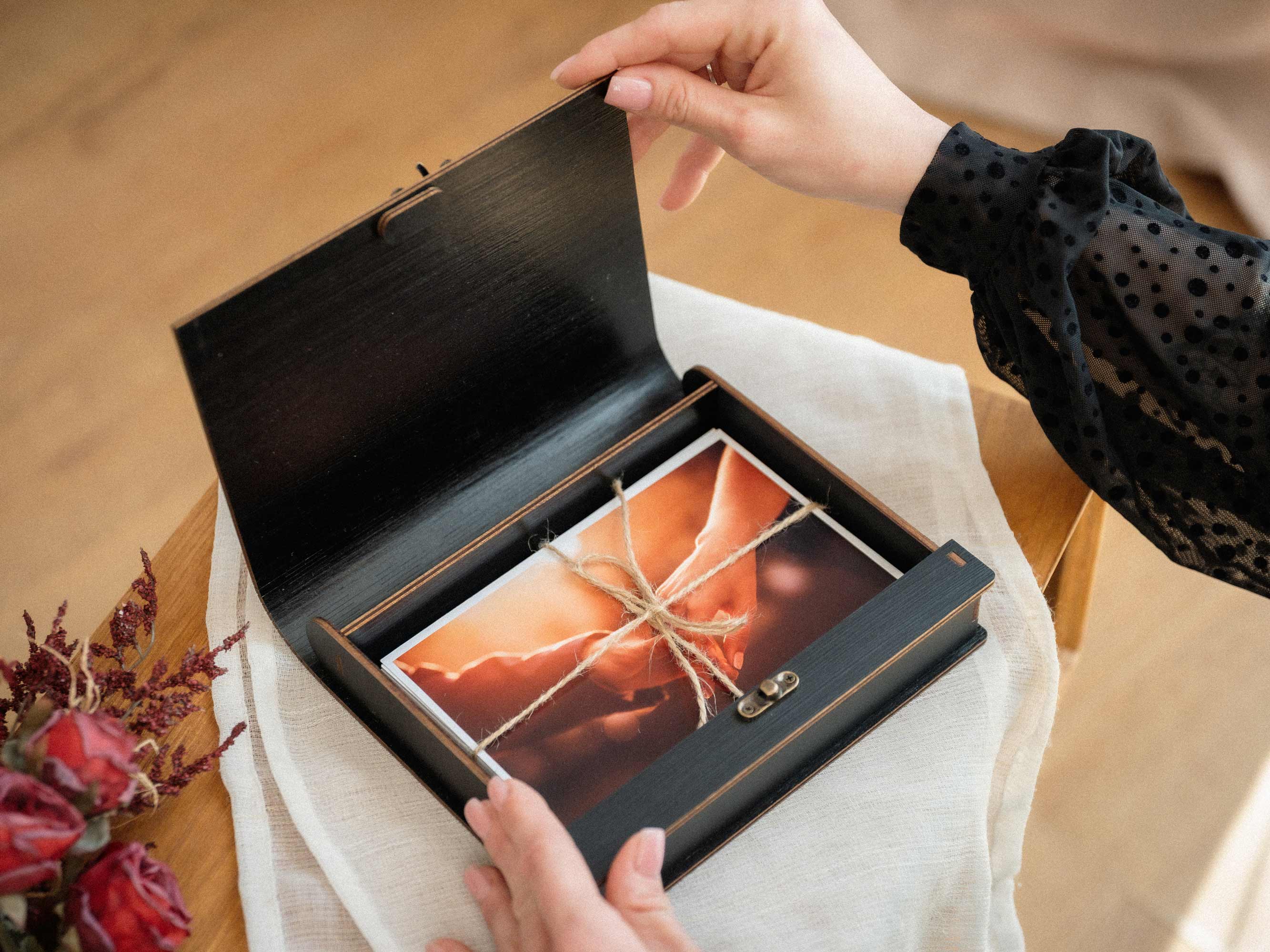Closed black wooden wedding photo box with personalized engraving
