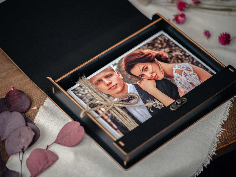 Elegant black wooden photo presentation box with custom engraving for wedding photos