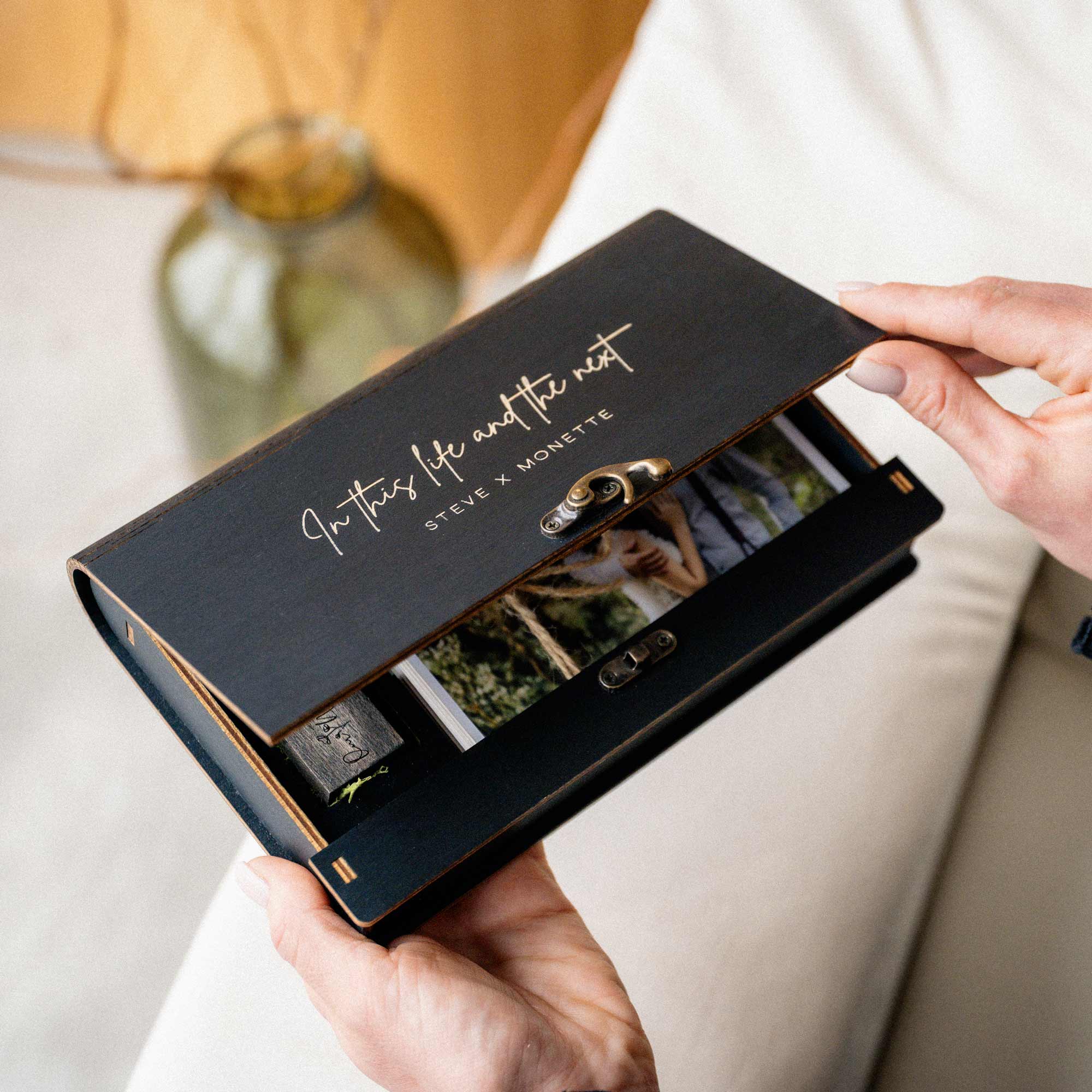 Personalized black photo presentation box with wedding photos and USB drive