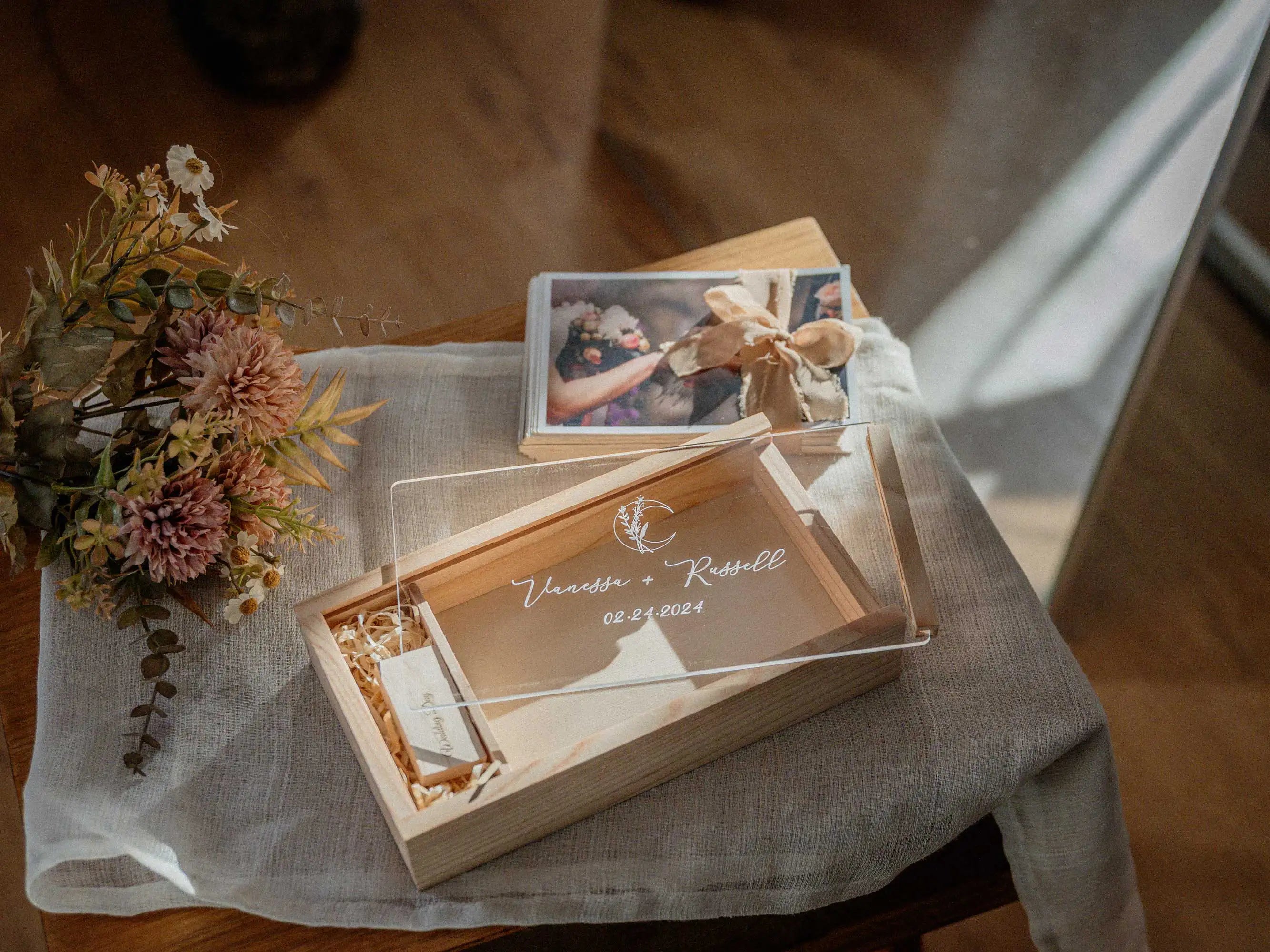 Maple wooden photo box with removed acrylic lid and prints