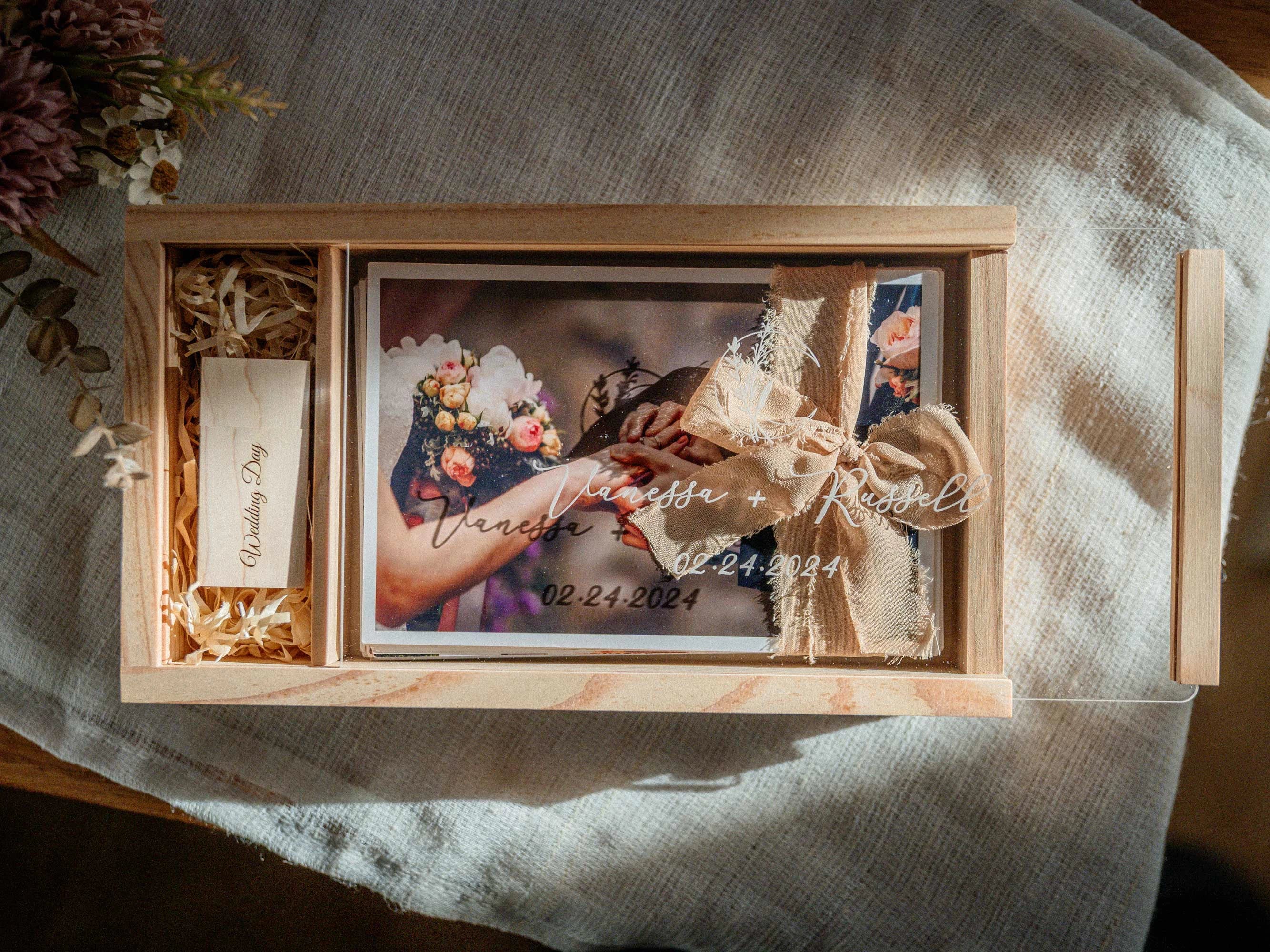 Top view of maple wedding photo box with photo prints