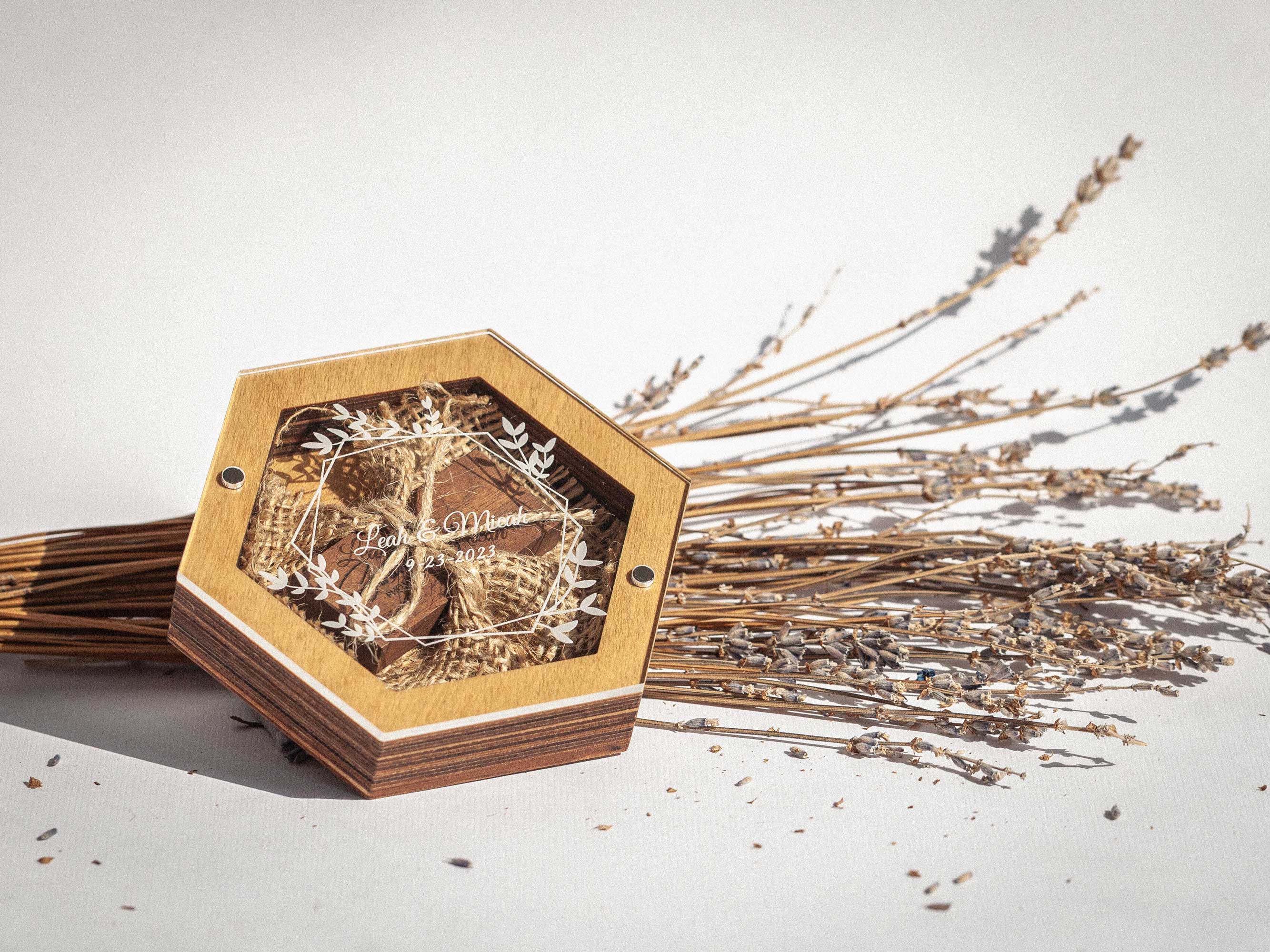 Gold Oak hexagon wedding USB box on dried grass with personalized acrylic lid