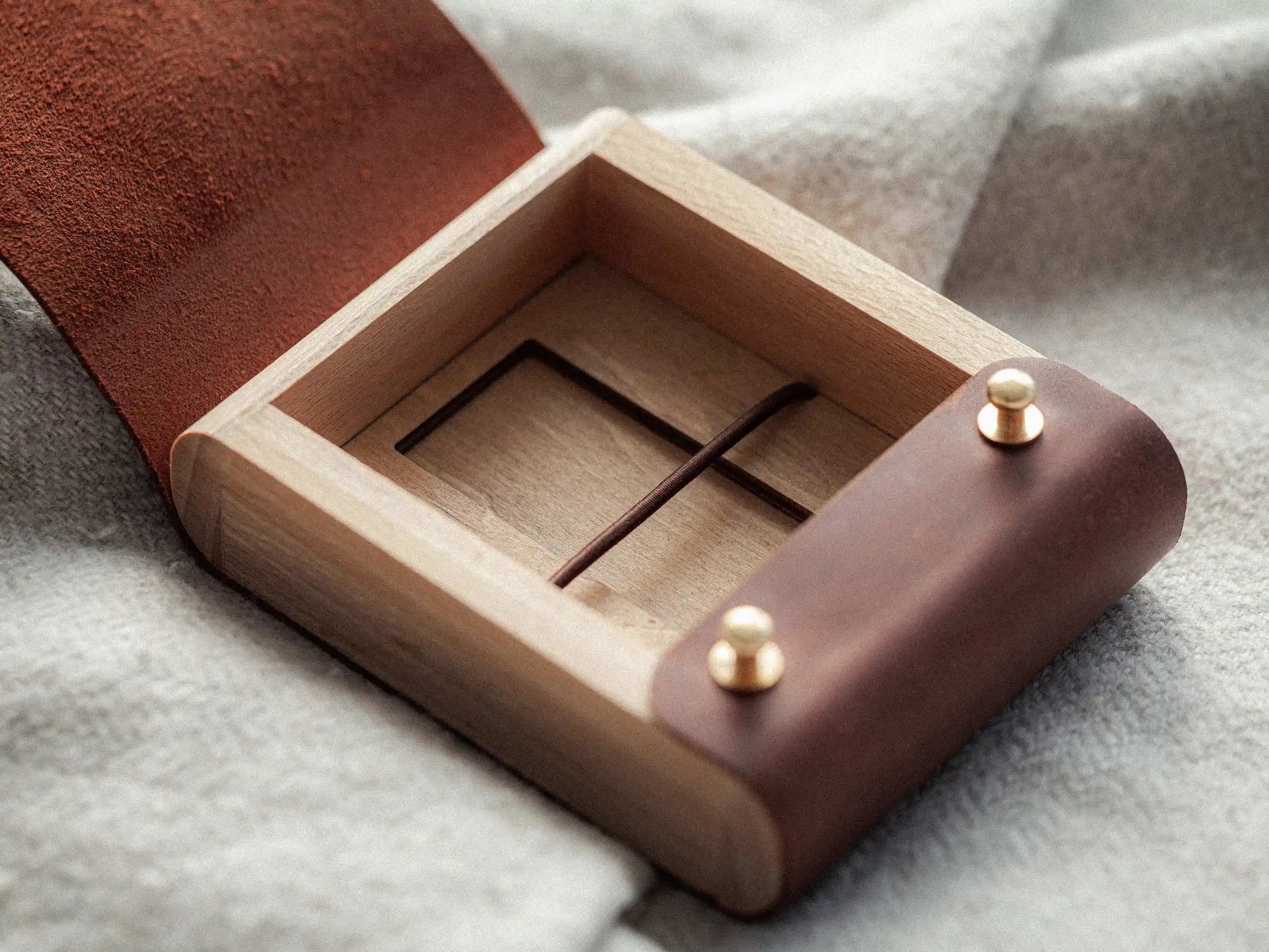 Open leather USB presentation box showing inner compartment and elastic holder