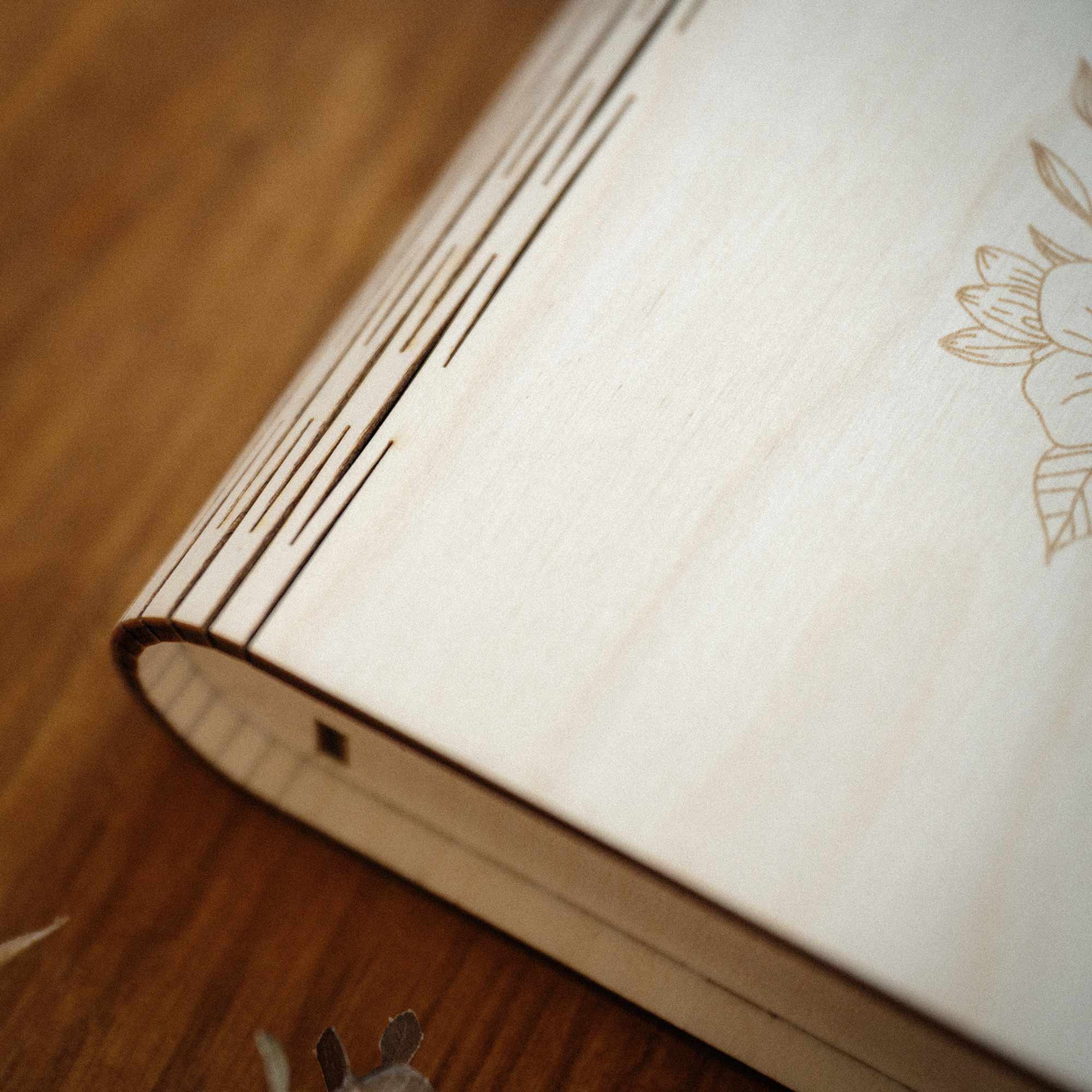 Side detail of maple wooden photo box lid and curved spine edge