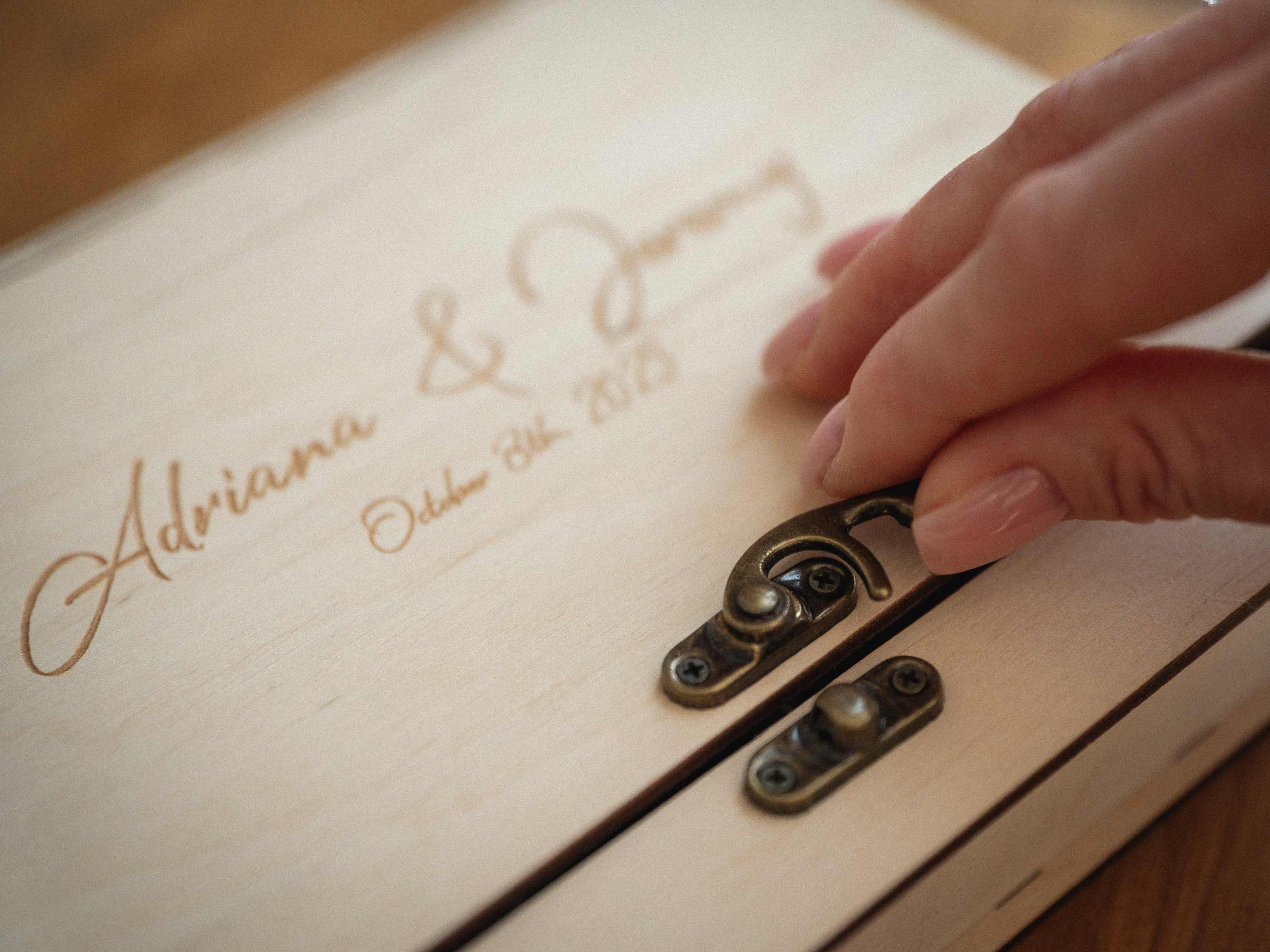 Close-up of personalized engraving on Maple photo box
