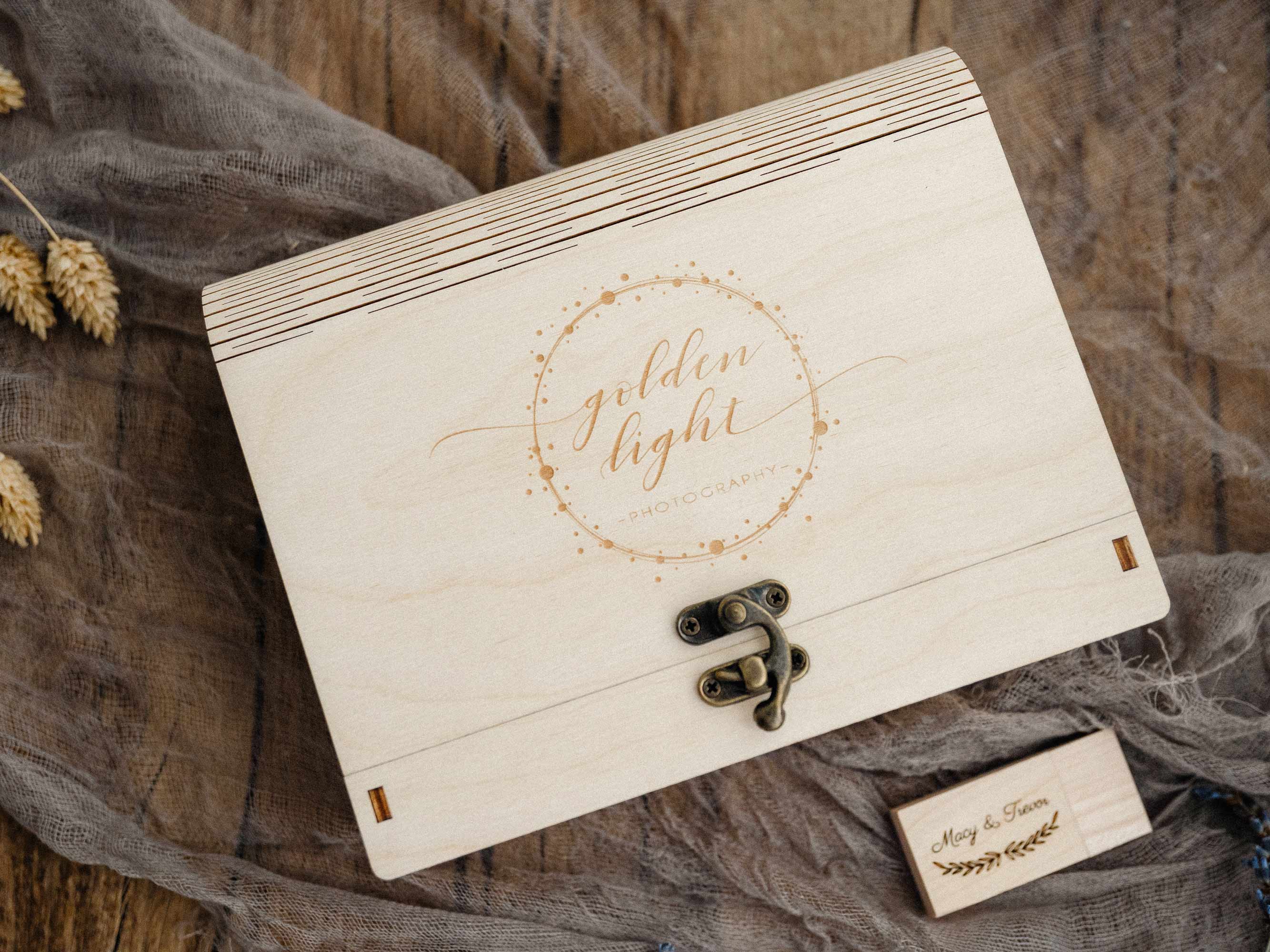 Top view of closed maple wedding photo box with engraved lid and vintage hook