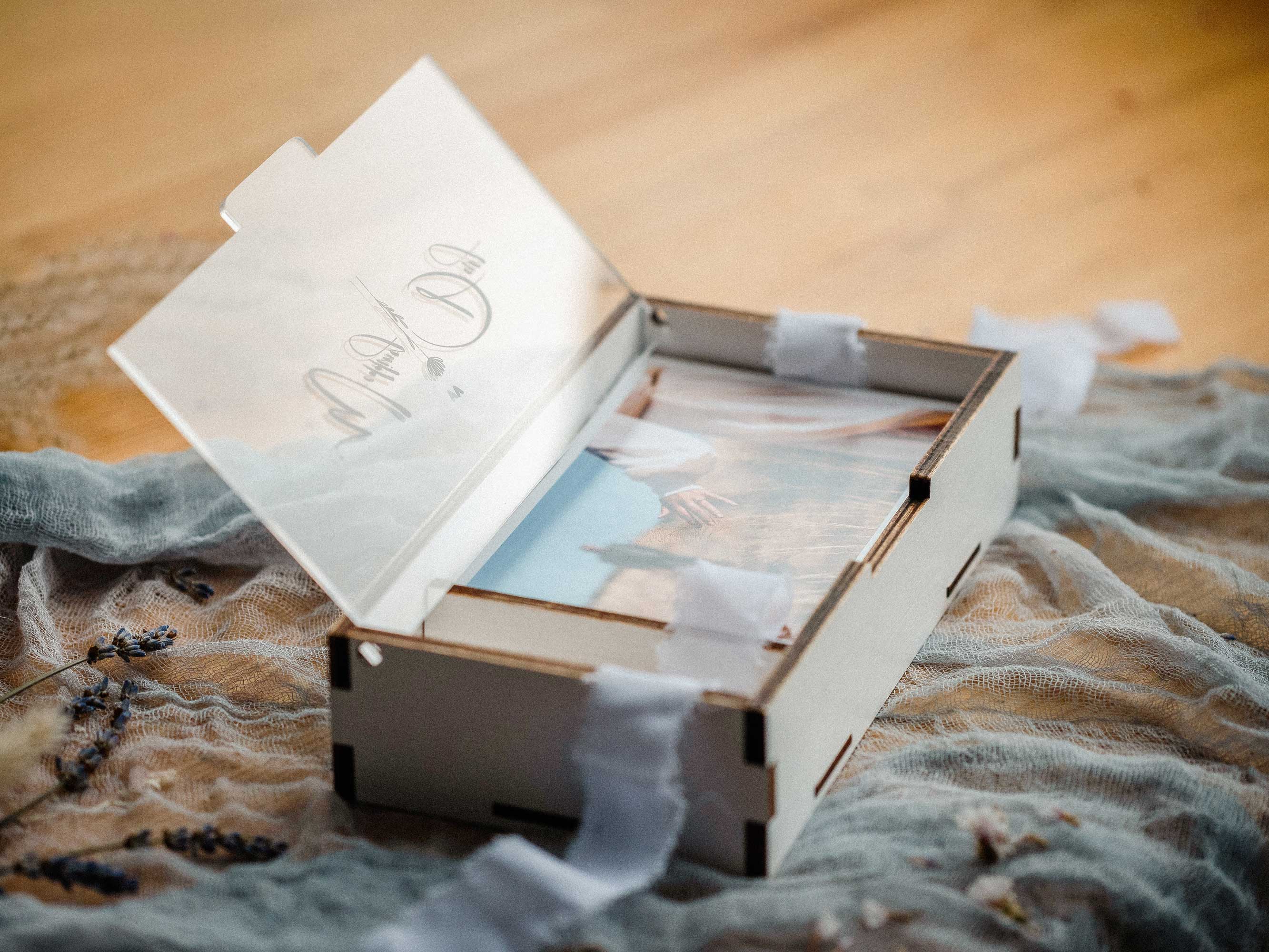 Open white wedding photo box with USB compartment and personalized acrylic lid
