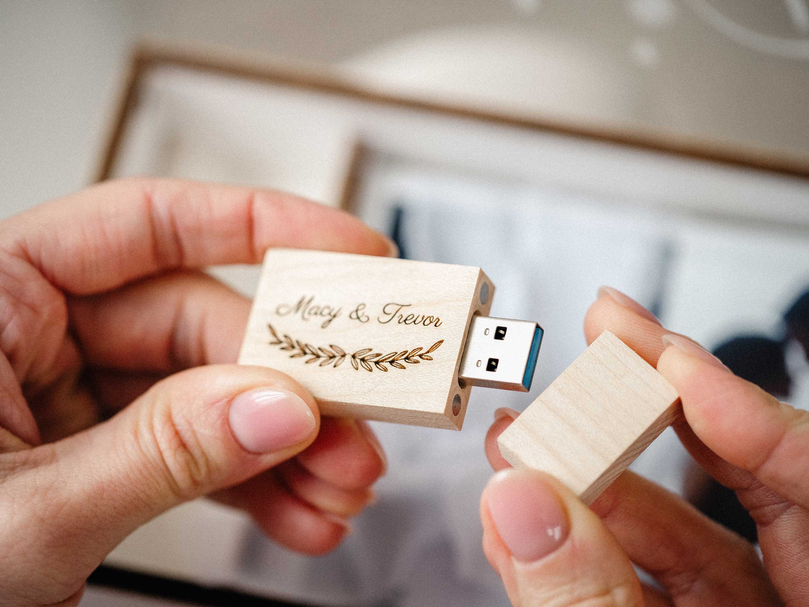 Personalized wooden USB flash drive for wedding photo box held in hands