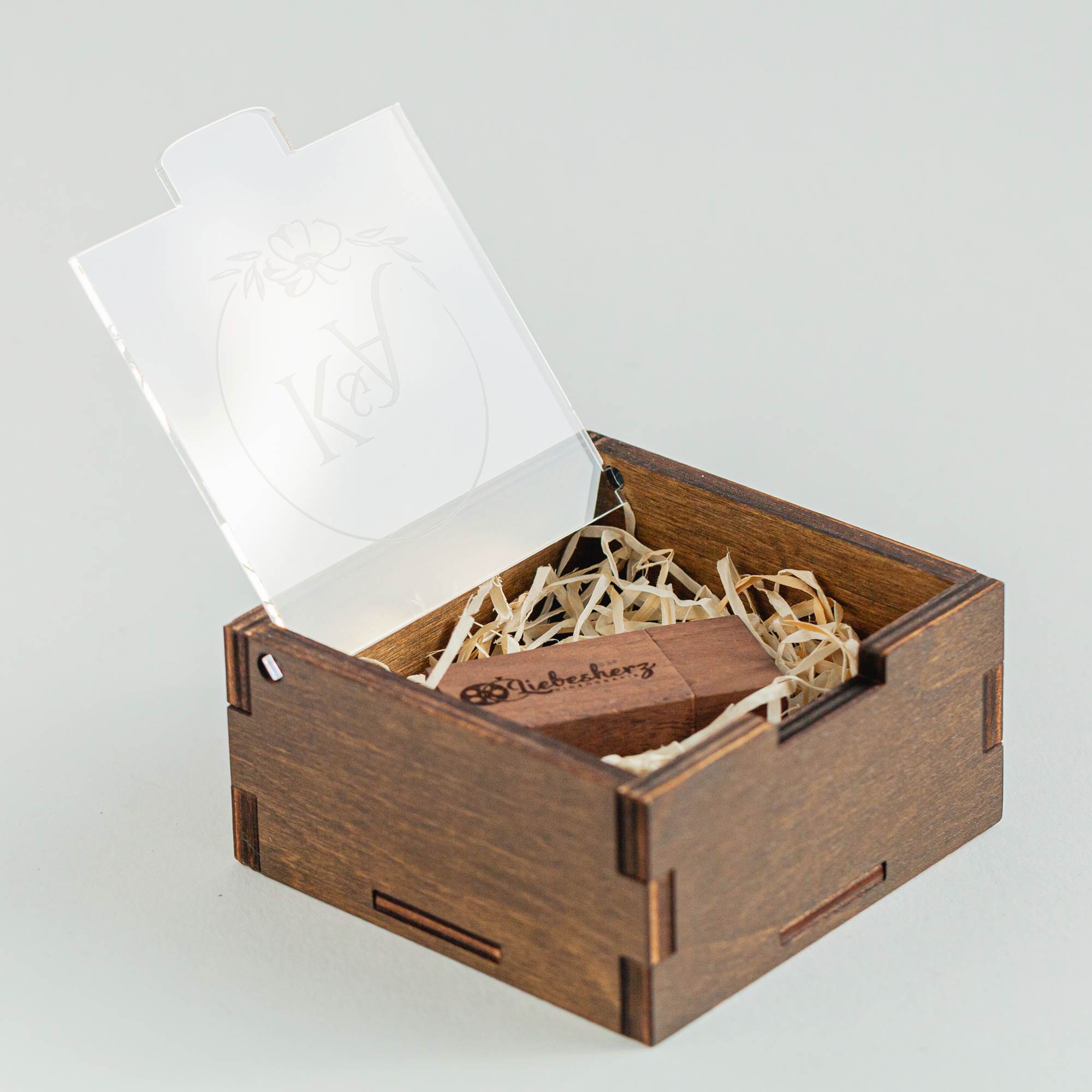 Walnut wooden USB box with acrylic lid and decorative wood shavings