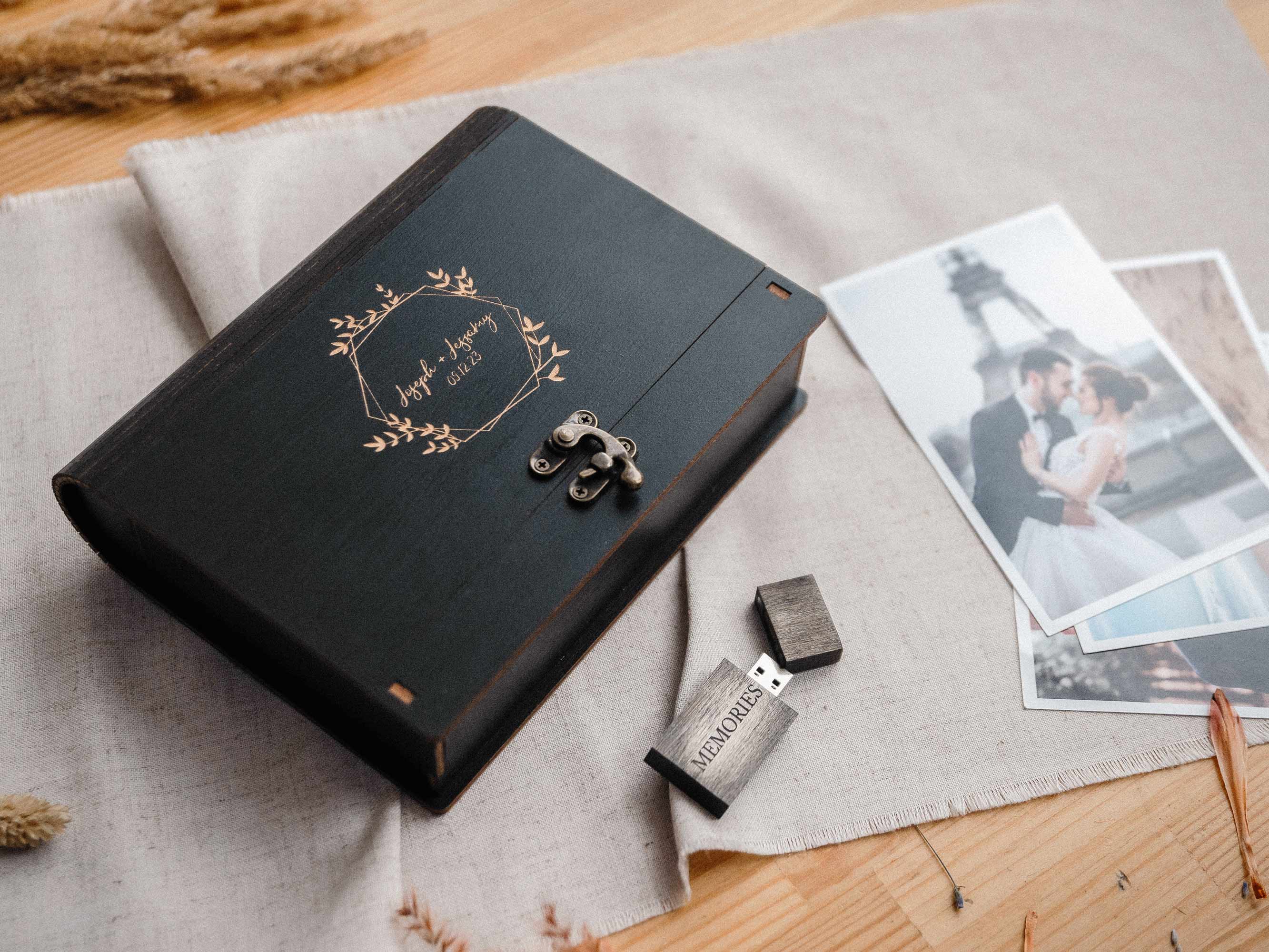 Black wooden photo box flatlay with photo prints and optional USB, elegant photography packaging