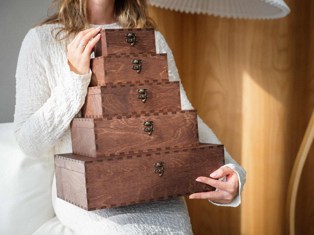Stack of personalized wooden memory boxes in different sizes