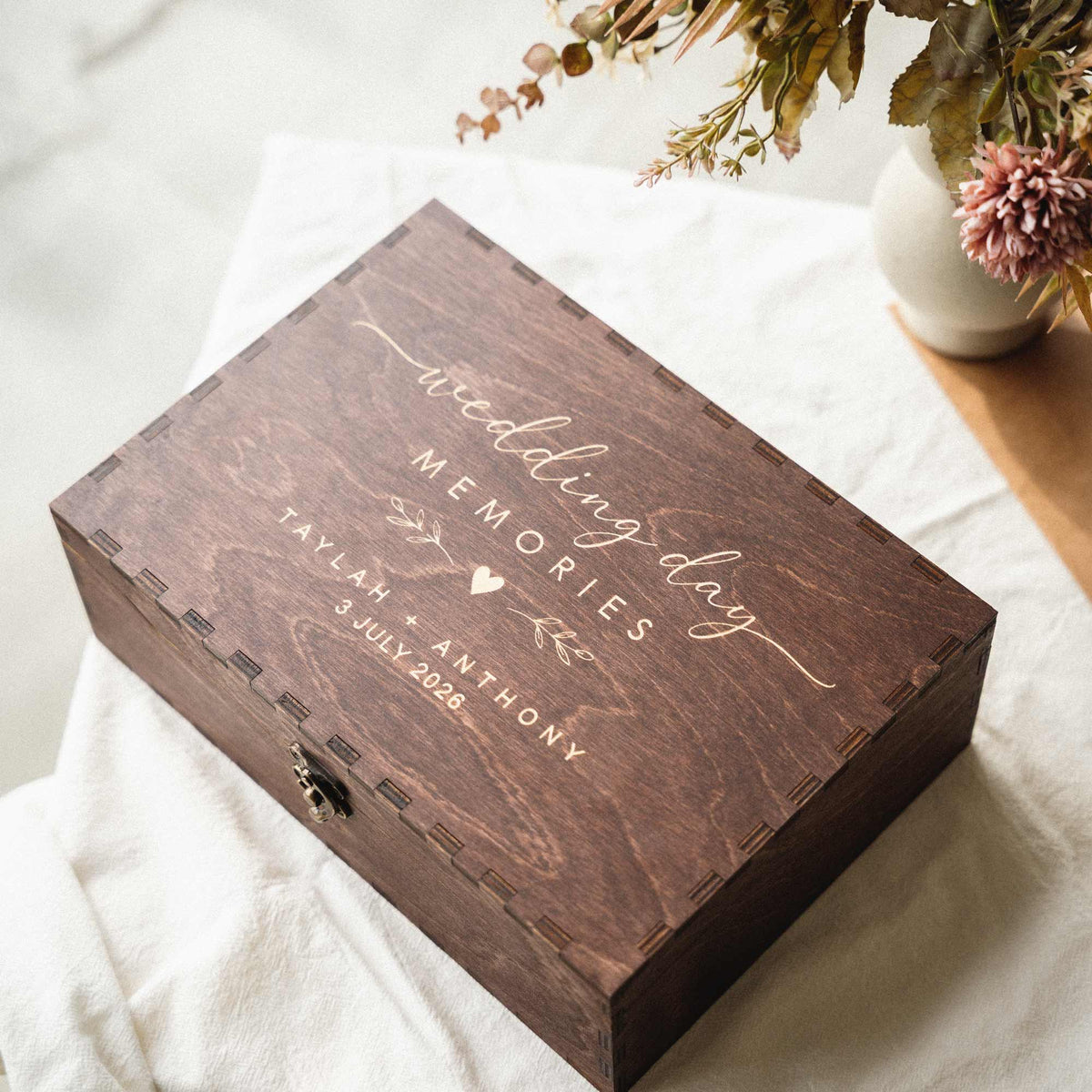 Personalized wedding day memories box displayed with dried flowers