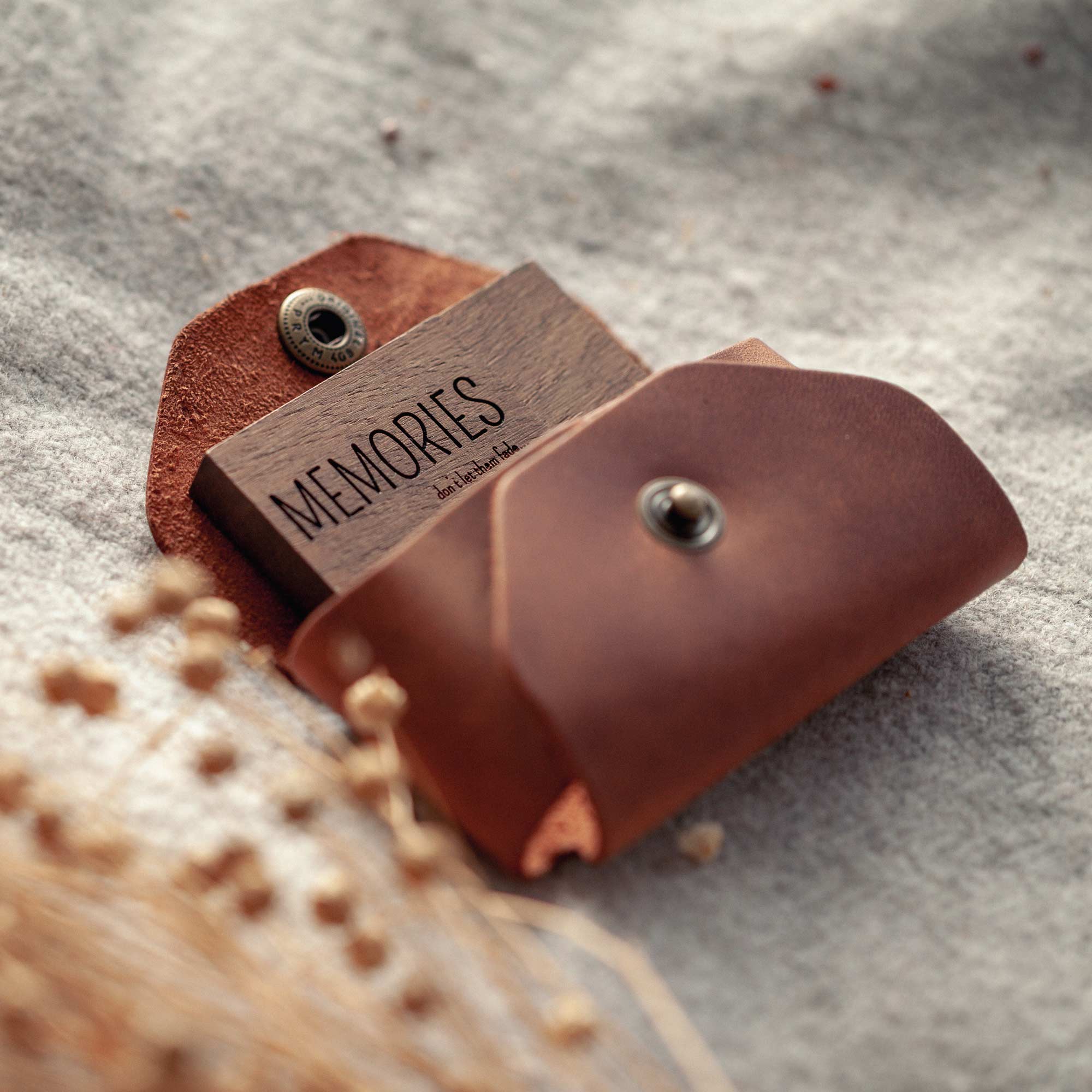 Two leather USB cases with engraved wooden flash drive for wedding photographers