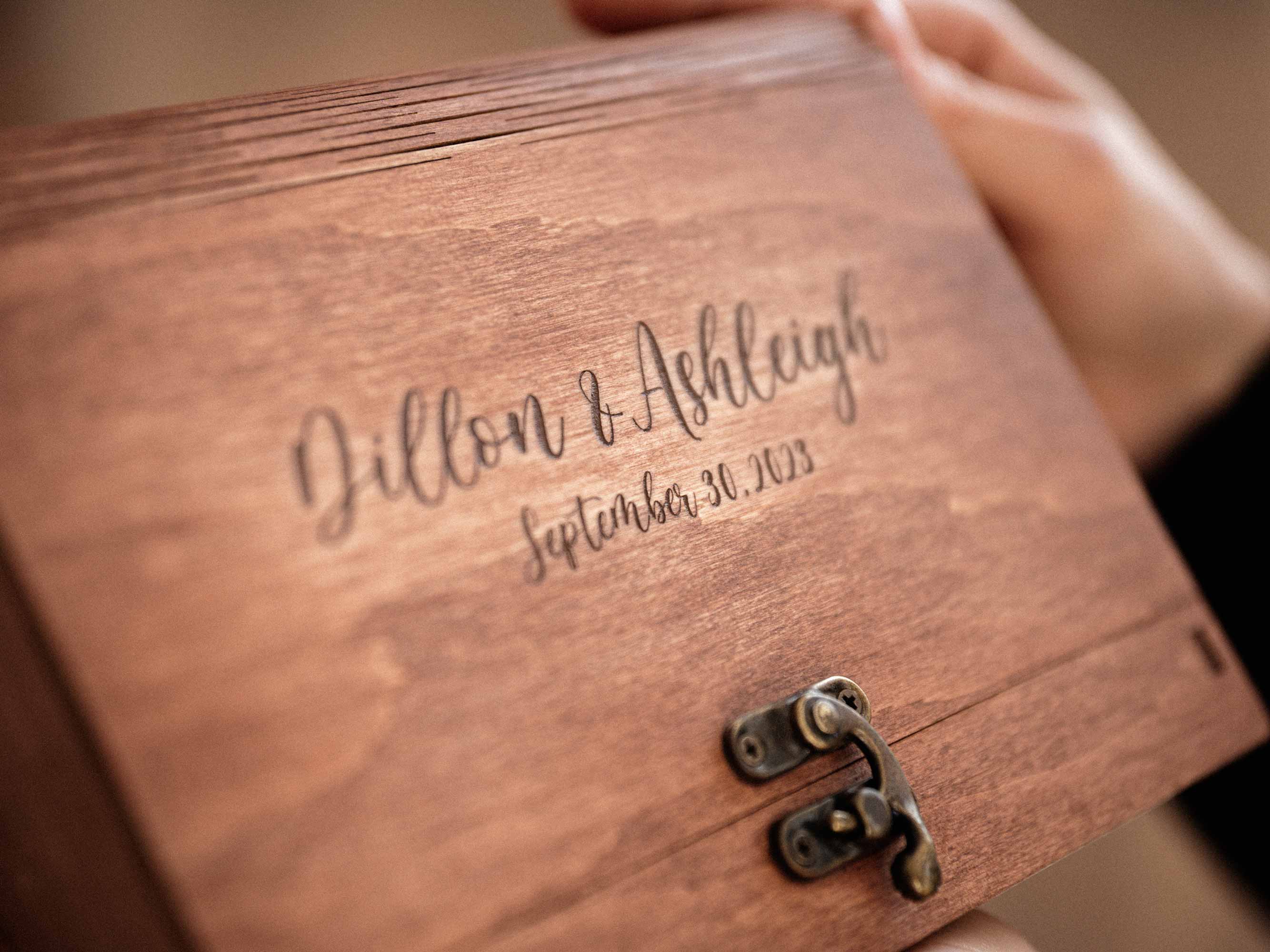 Personalized teak photo box with engraved wedding names on lid