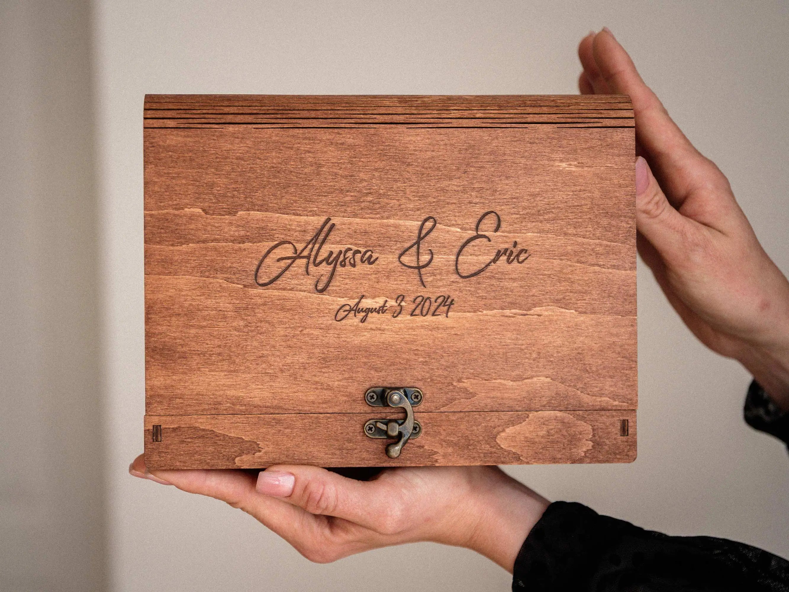 Personalized teak photo keepsake box with engraved lid held in hands