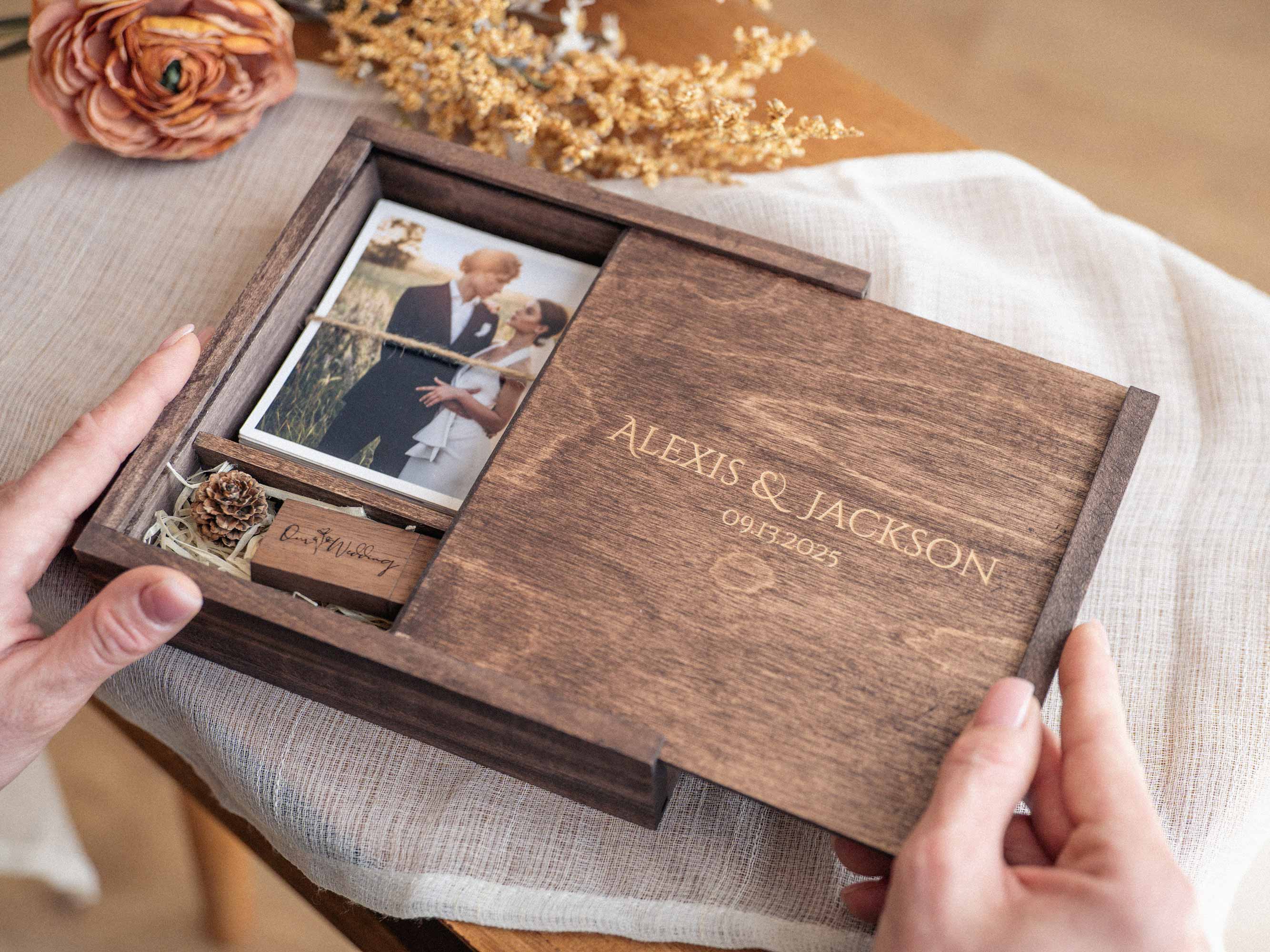 Open Walnut Classic photo box with prints and USB compartment for client presentation