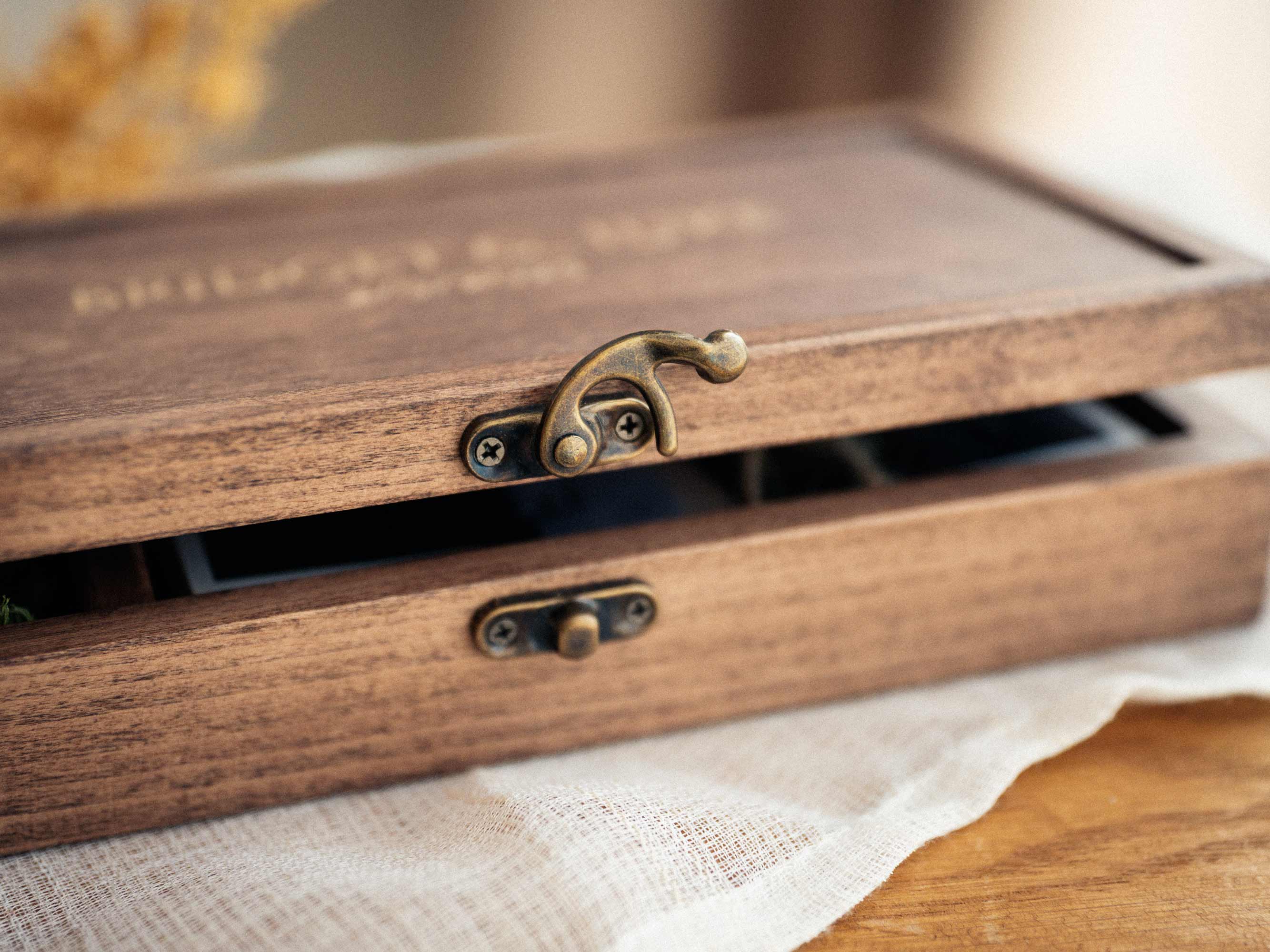 Close-up of Walnut Classic hinged photo box with metal closure
