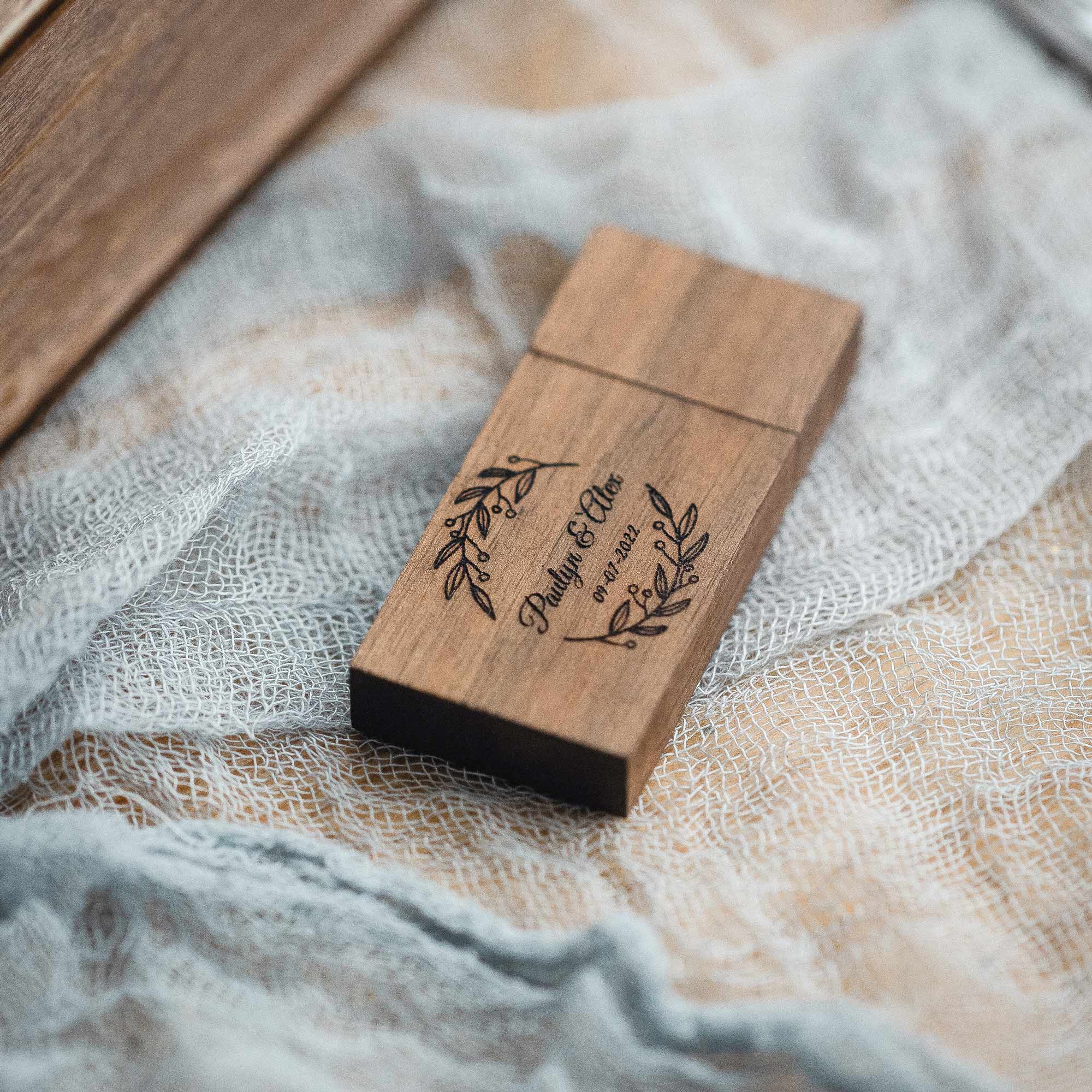 Engraved wooden USB flash drive on linen, wedding photographer packaging accessory