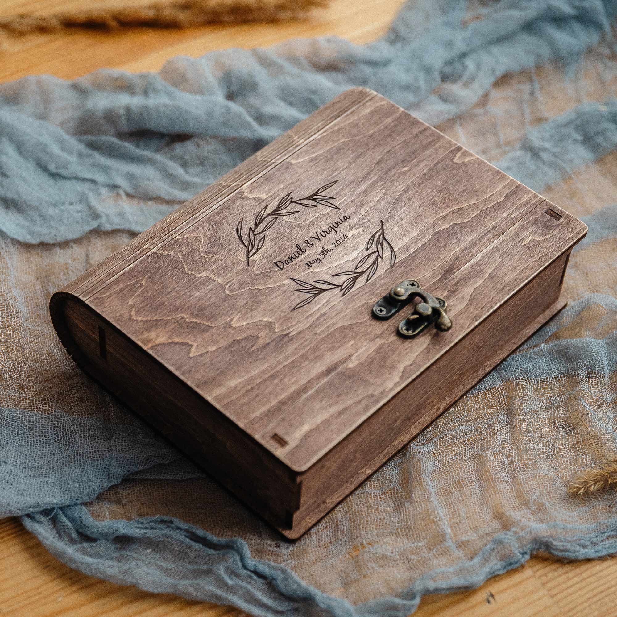 Closed vintage walnut photo box on linen with warm styling, wedding keepsake presentation