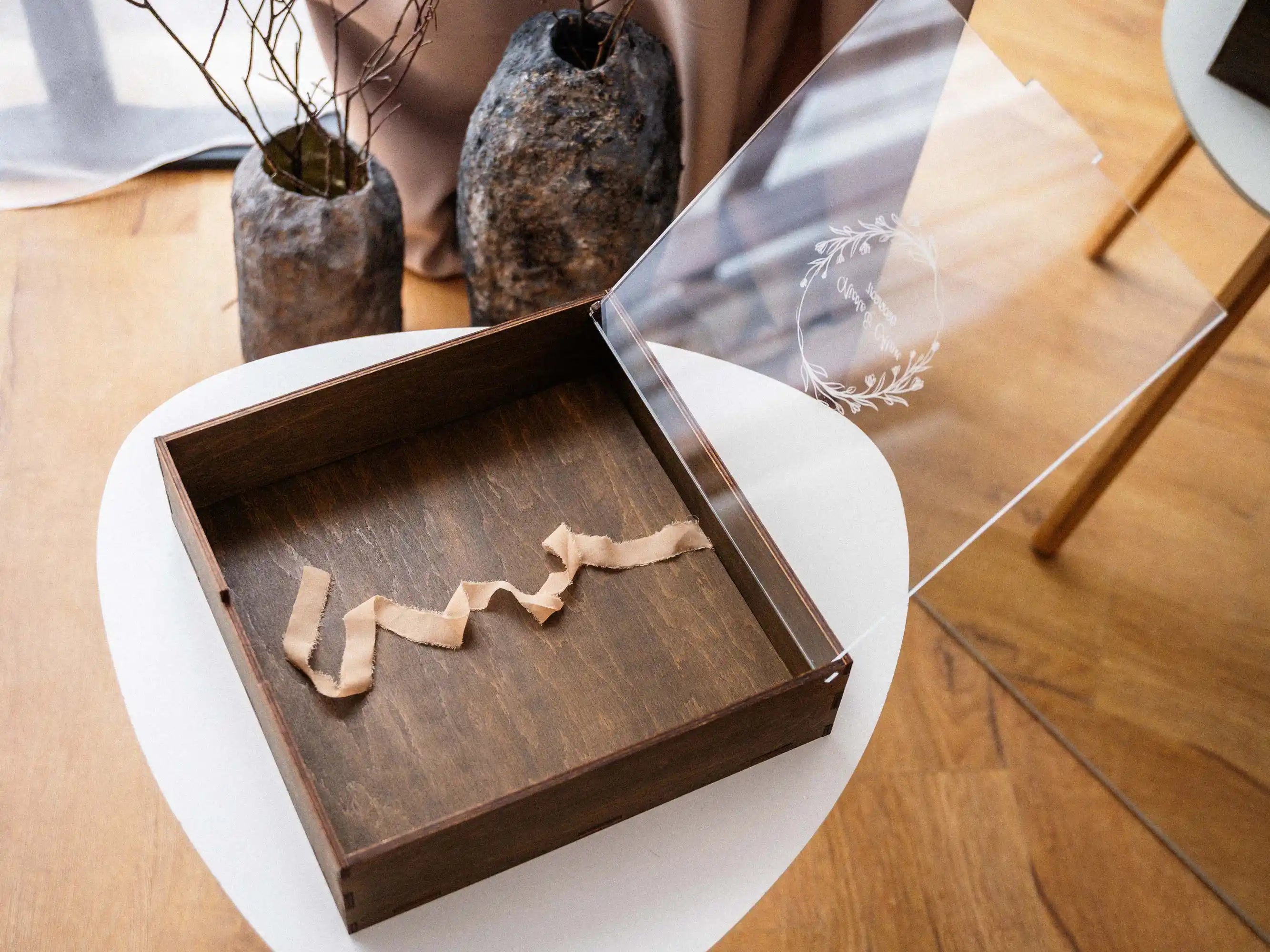 Open walnut acrylic lid album box with ribbon pull inside