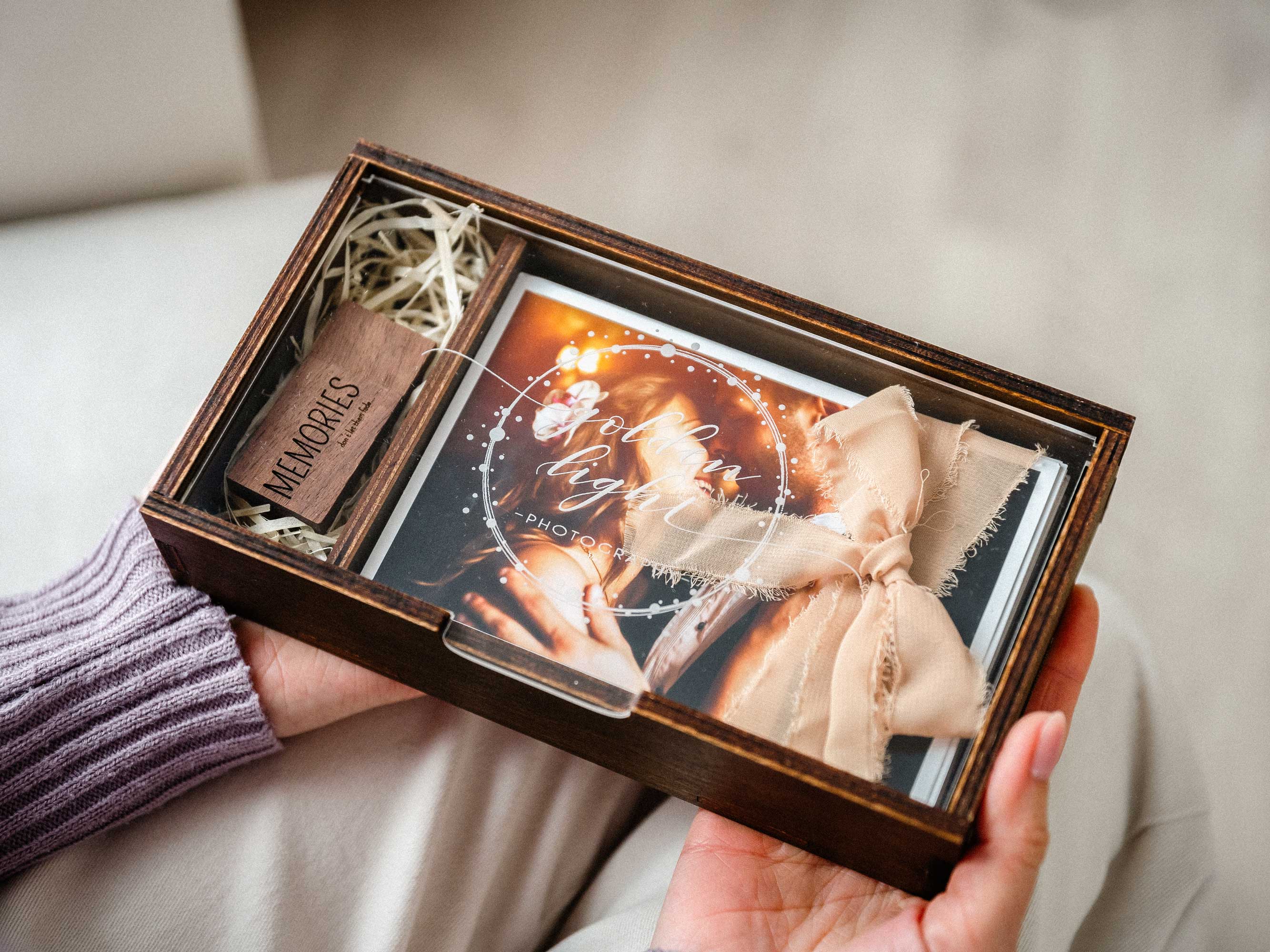 Wooden wedding photo box with USB compartment and printed photo held in hands