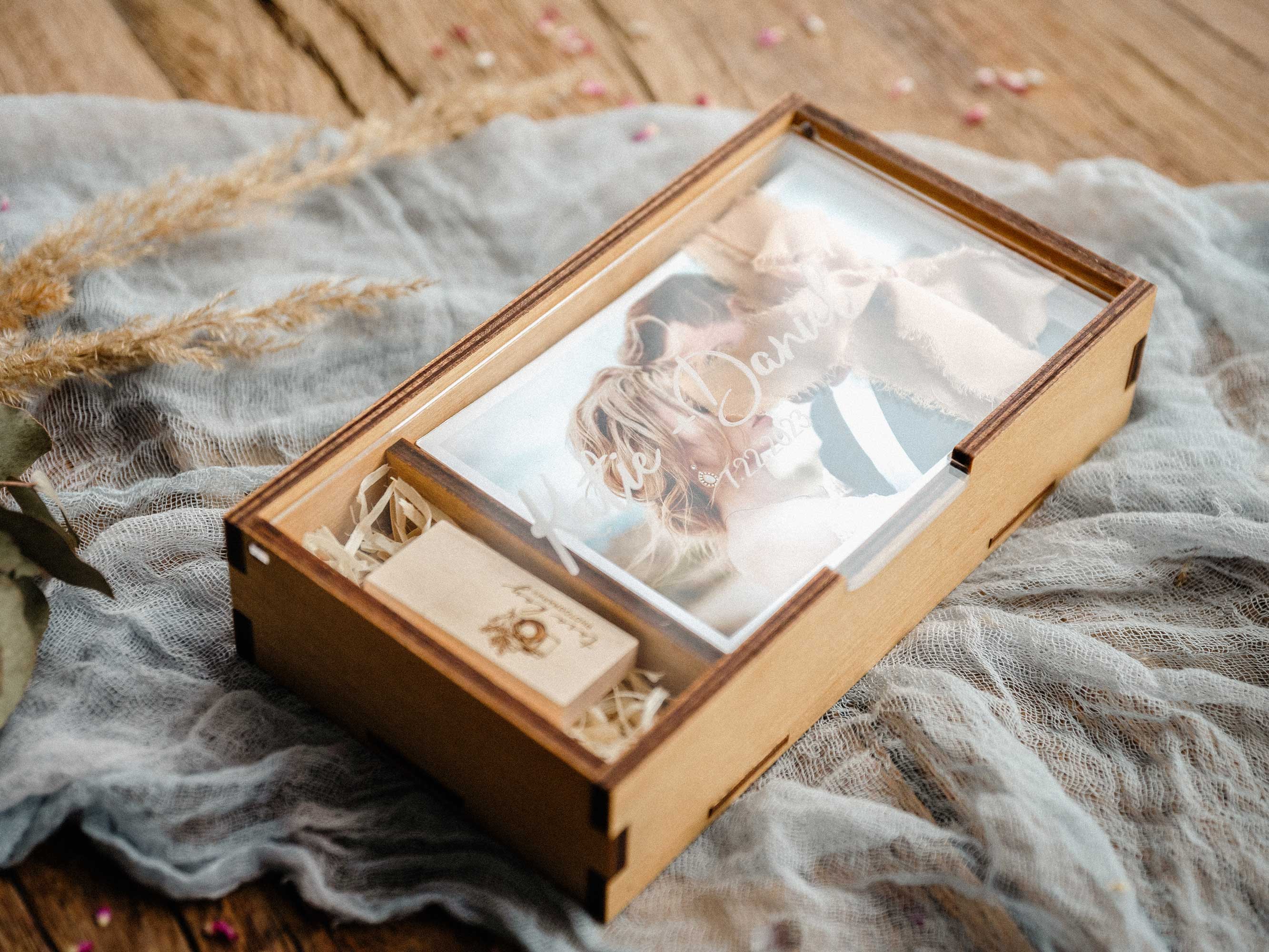 Open Gold Oak wooden photo box with empty photo section and stack of prints