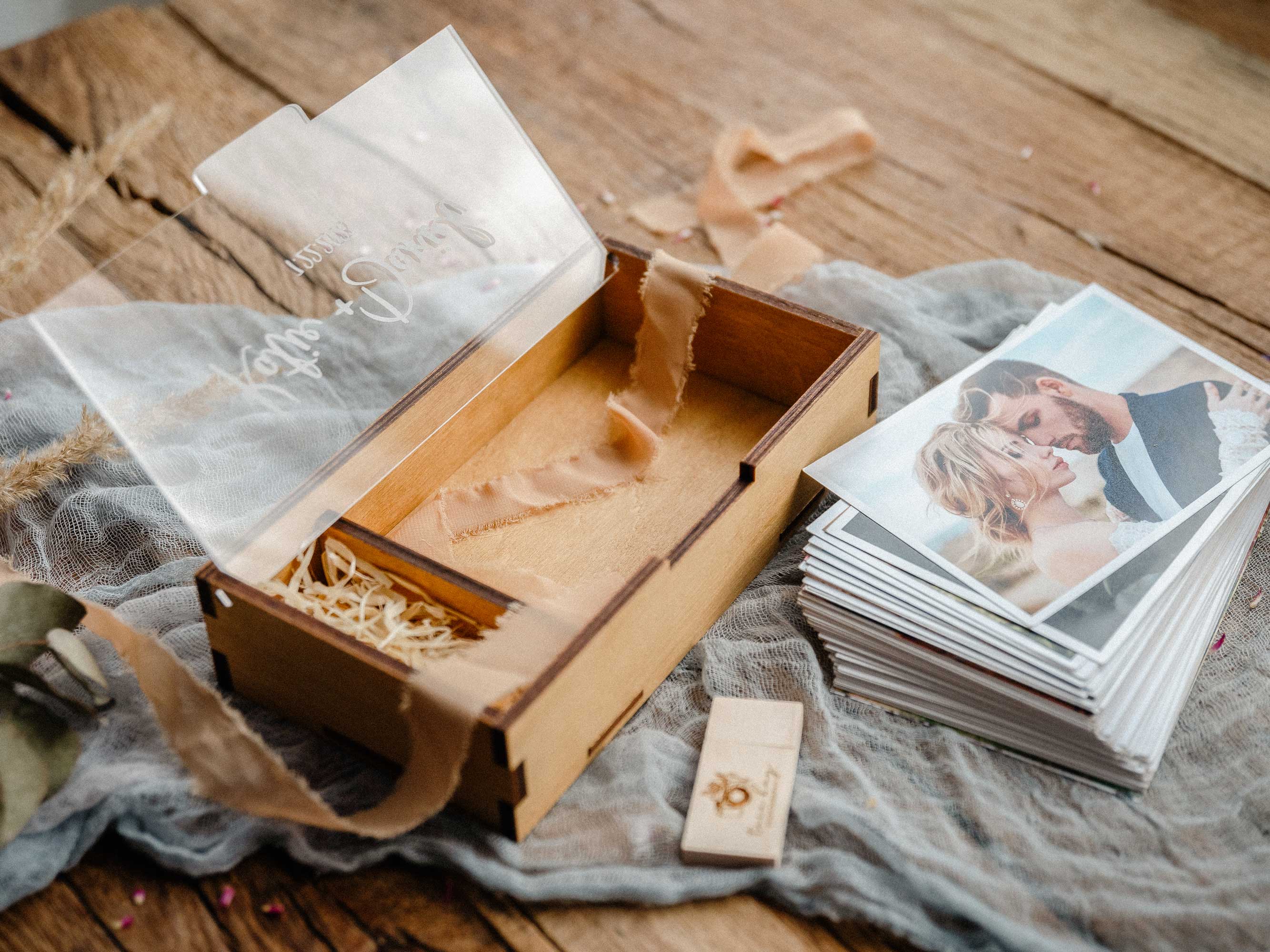 Open Gold Oak wooden photo box with empty photo section and stack of prints